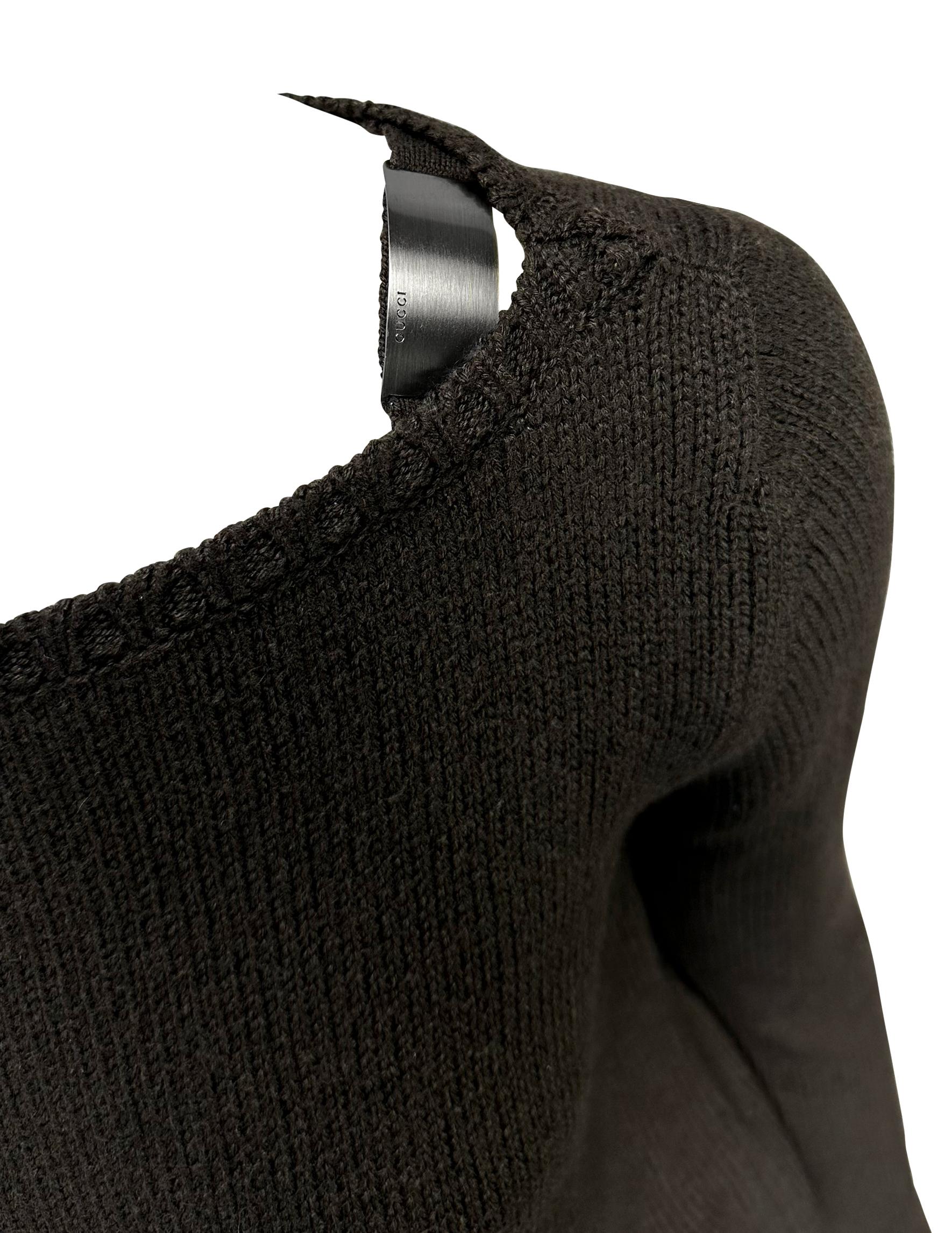 This beautiful brown wool Gucci sweater, designed by Tom Ford for the Fall/Winter 1997 collection, features a wide neckline and is adorned with gunmetal accents that secure the wide bateau neckline.

Approximate measurements:
Size - M
Shoulder to
