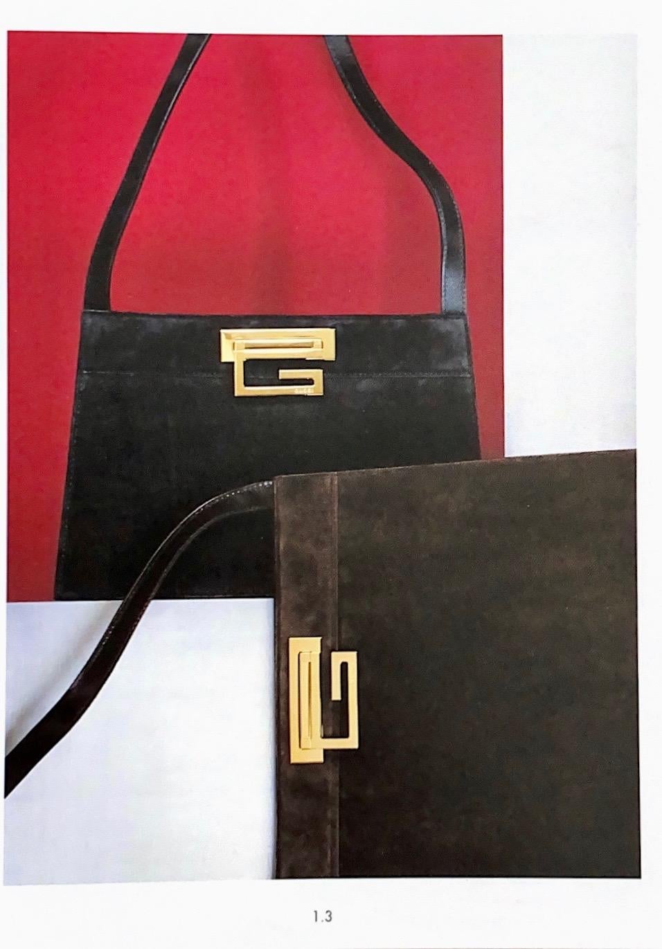 Presenting a rare silk-satin asymmetric mini bag designed by Tom Ford for the Fall/Winter 1997 Gucci collection. The gold-toned G-lock hardware is featured in the F/W 1997 catalog on multiple bags and adds a sleek brand signature to the front of the