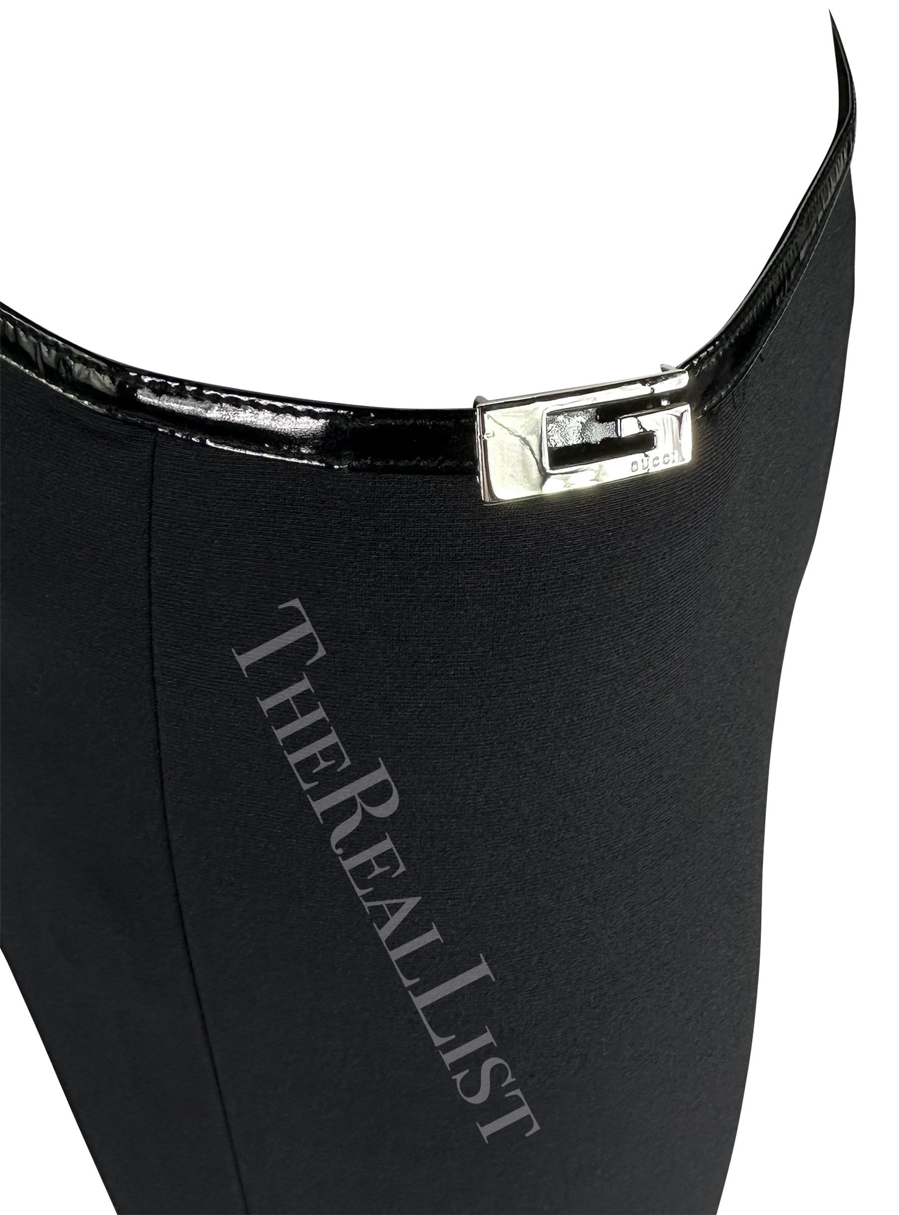 Presenting a pair of black Gucci formfitting pants, designed by Tom Ford. From the Fall/Winter 1997 collection, these pants feature an asymmetrical cut at the top. As seen on the season's runway on Rhea Durham and Kiara Kabukuru. These stretchy