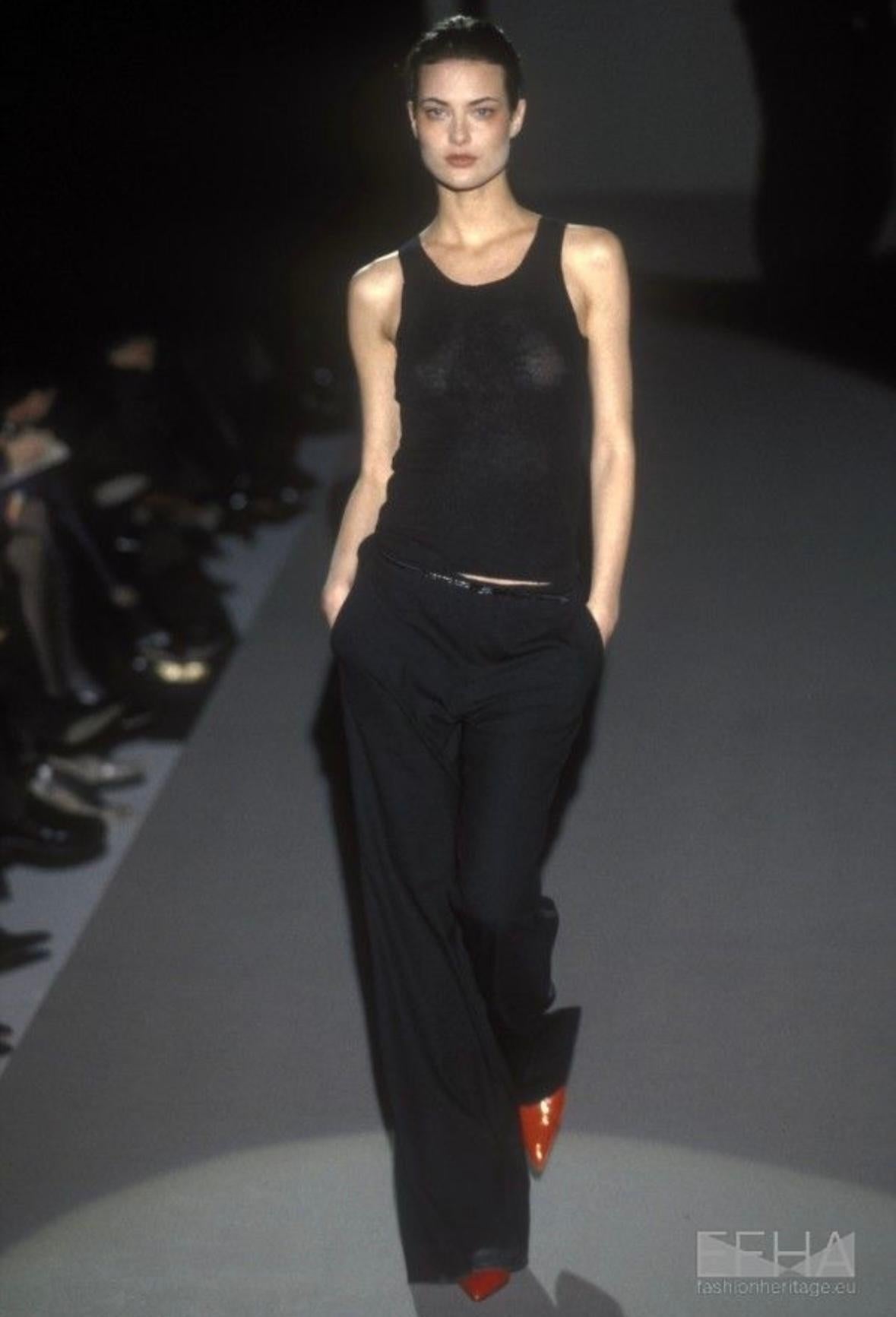 Presenting a black Gucci cashmere tank top, designed by Tom Ford. From the Fall/Winter 1997, this luxurious tank top features a wide neckline and wide shoulder straps. A version of this piece debuted in the season's runway presentation on Shalom