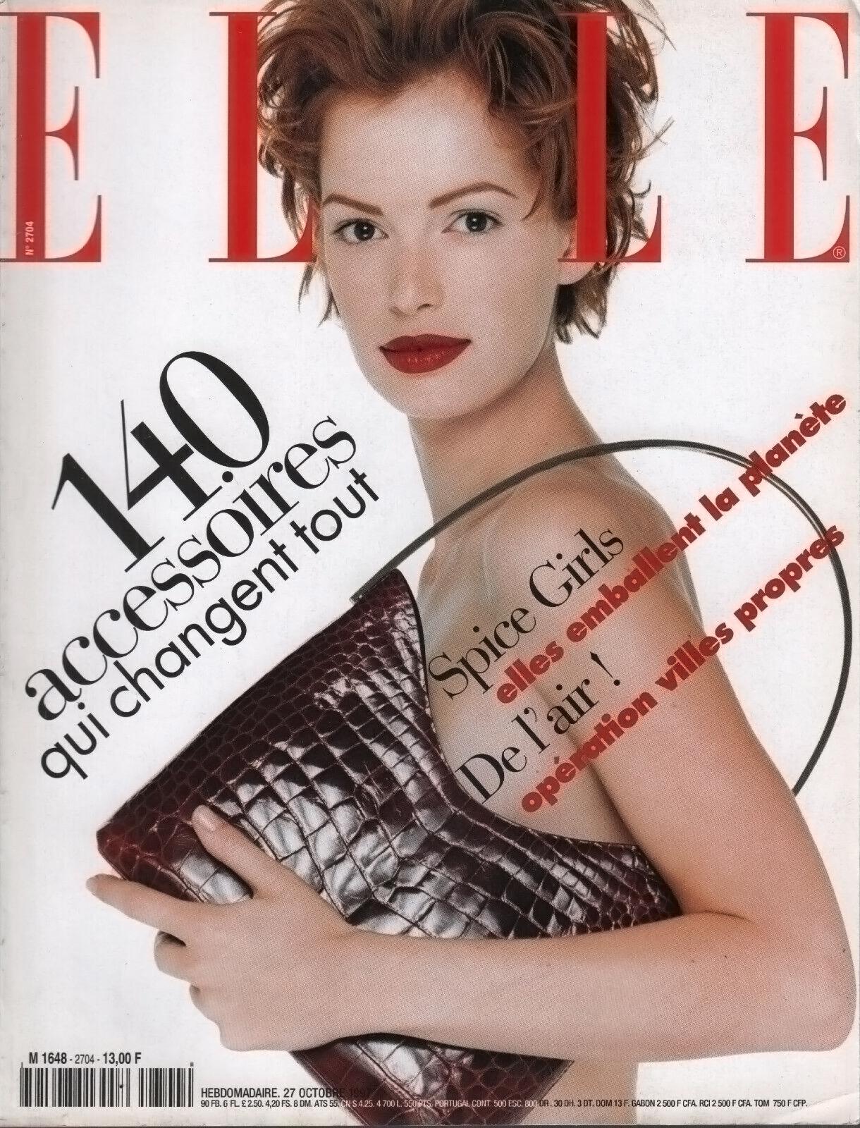 This iconic red metallic alligator Gucci bucket bag, designed by Tom Ford for the Fall/Winter 1997 collection, is crafted from genuine alligator skin with a light metallic finish. It features an attached matching coin purse and a silver-plated metal