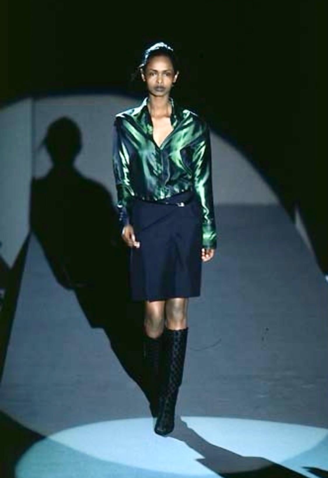 Presenting an electric green iridescent Gucci silk button-up shirt, designed by Tom Ford. From the Fall/Winter 1997 collection, this top was featured on the season's runway in multiple color variations and is one of Ford's more notable pieces during