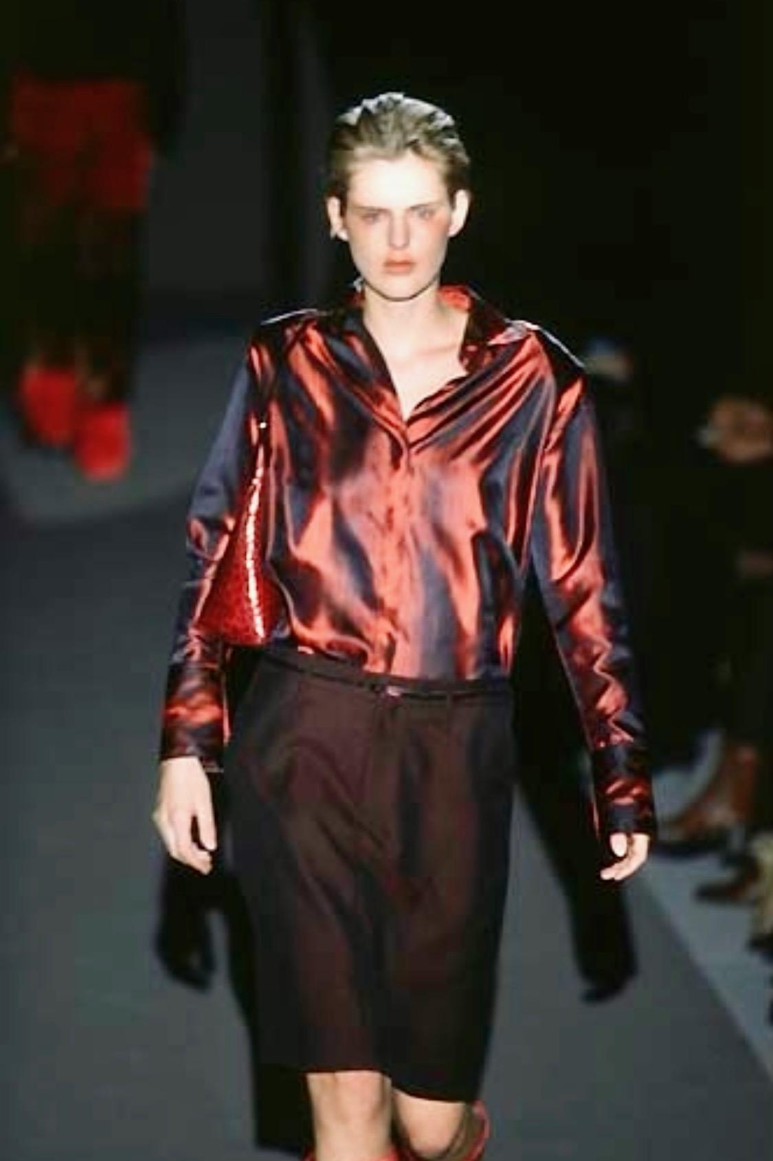Presenting a fiery red iridescent Gucci silk button-up shirt, designed by Tom Ford. From the Fall/Winter 1997 collection, this top was featured on the season's runway in multiple color variations and is one of Ford's more notable pieces during his