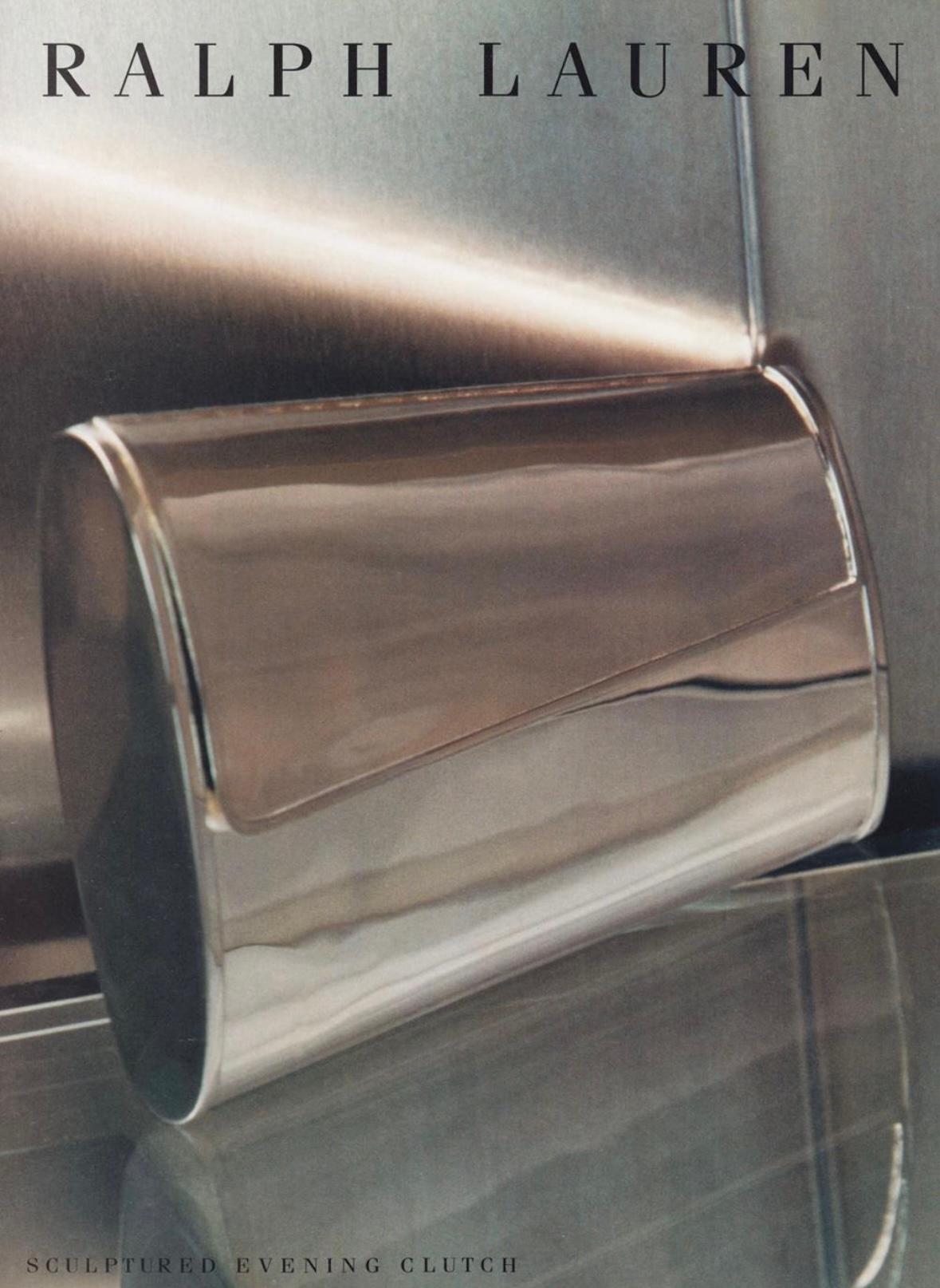From the Fall/Winter 1997 Ralph Lauren collection, this stunning silver-plate hardshell bag debuted on the season's runway on Tricia Helfer and was also included in the season's ad campaign, captured by Sheila Metzner. This shiny, sleek clutch bag