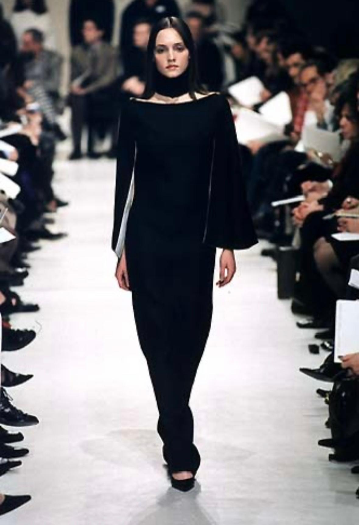 From Nicolas Ghesquière's Fall/Winter 1998 collection at Balenciaga, this black linen capelet dress debuted on the season's runway. Constructed of lightweight sheer linen, this runway gown draws inspiration from Cristobal Balenziaga's designs in the