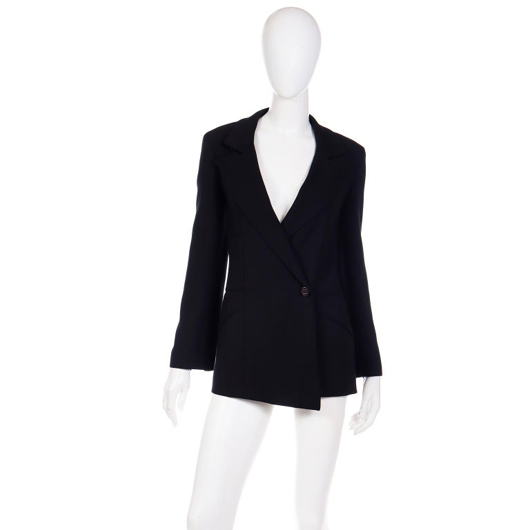 This is a lovely vintage 19990's Chanel black blazer style jacket that would make a timeless addition to any wardrobe! This jacket is from the Karl Lagerfeld Chanel 1998 Autumn collection which included a variety of black blazers in different