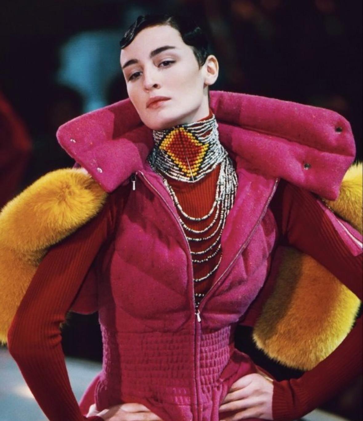 Presenting a beautiful beaded Christian Dior Masai choker, designed by John Galliano. From the Fall/Winter 1998 collection, this amazing choker features a red and yellow diamond pattern and is made complete with a gunmetal hook closure. This pattern