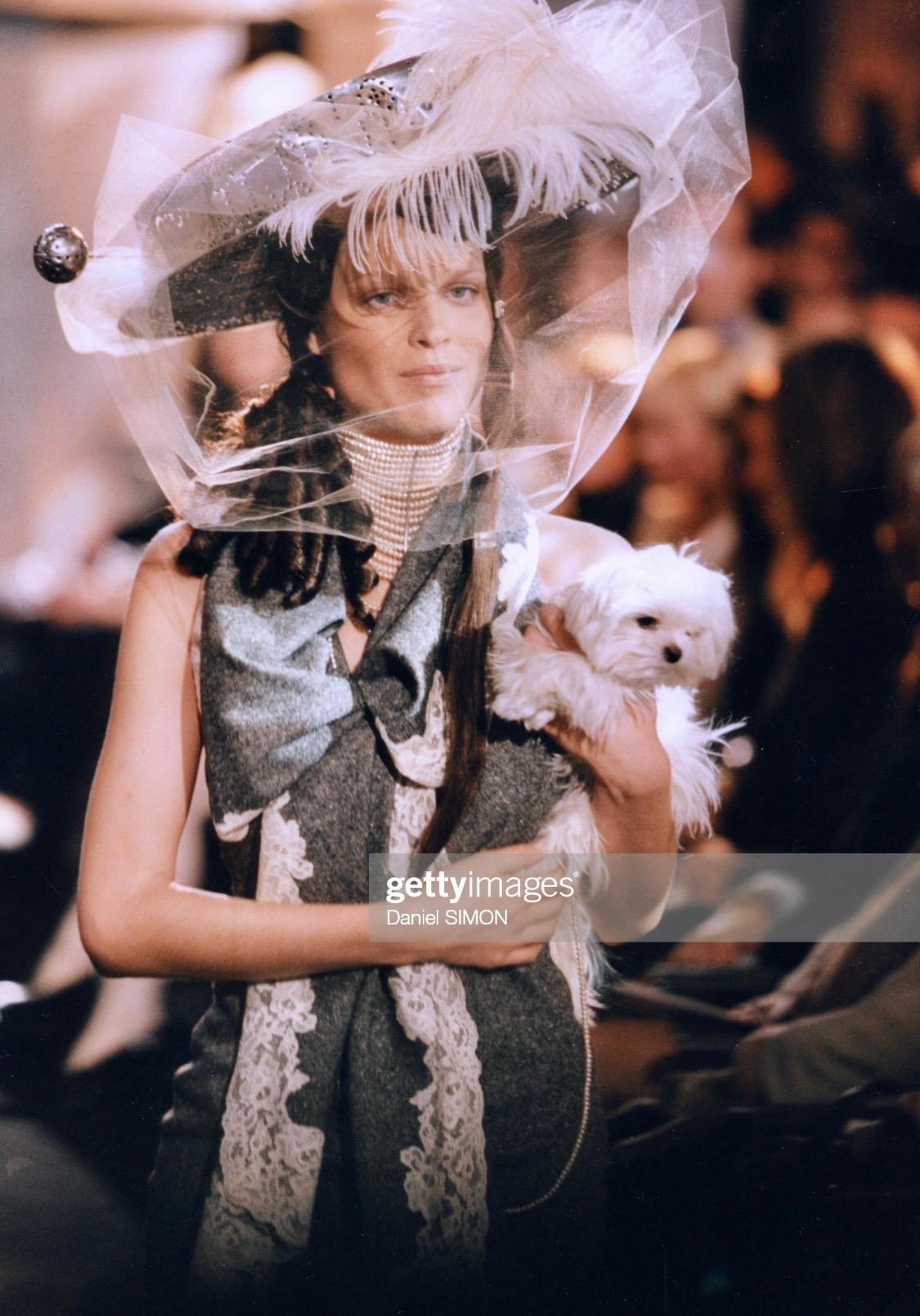 Presenting a lace-trimmed silk camisole designed by John Galliano for Christian Dior's Fall/Winter 1998 collection. A grey version of this lace trim design was featured in the Fall/Winter 1998 runway presentation on multiple looks. The matching