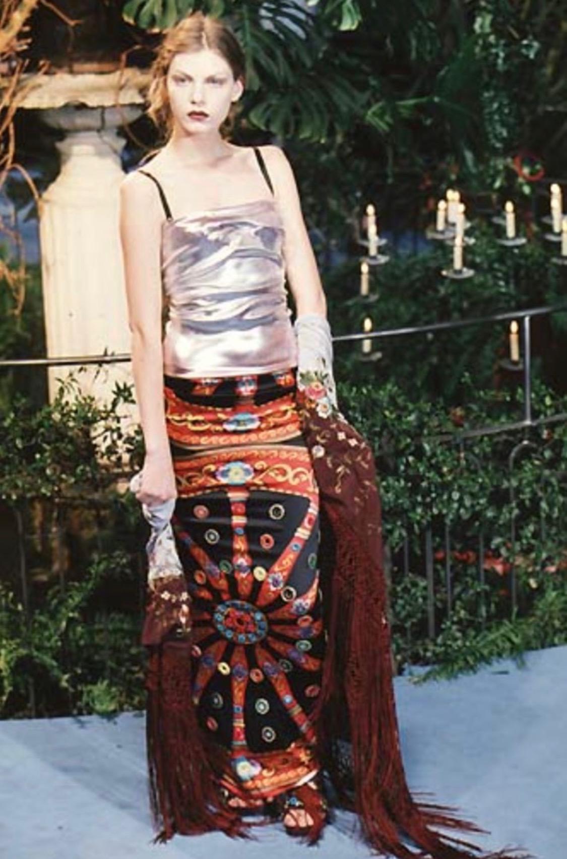 Presenting a printed silk tapered maxi skirt designed by Dolce and Gabbana for their Fall/Winter 1998 collection. Debuting in the season's runway presentation in black and navy, this piece features small circular mirror appliqués attached with