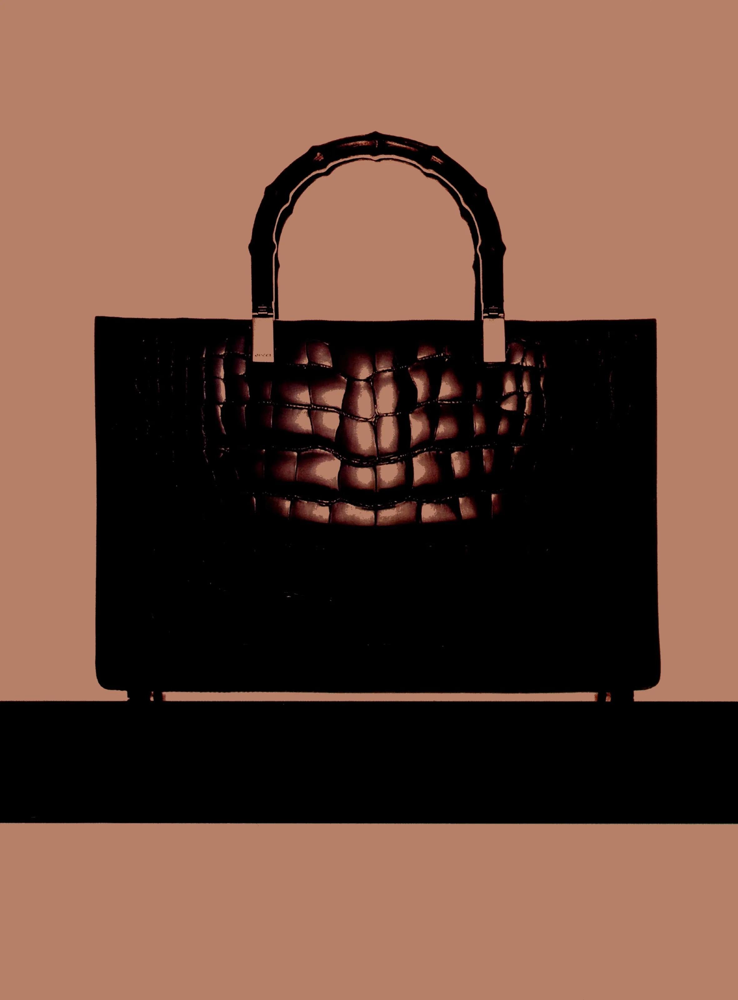 From the Fall/Winter 1998 collection, this Gucci by Tom Ford crocodile bamboo bag is a must-have for any Gucci-lover. Constructed entirely of glossy black crocodile, this bag was highlighted in the season's ad campaign, captured by Steven Klein.