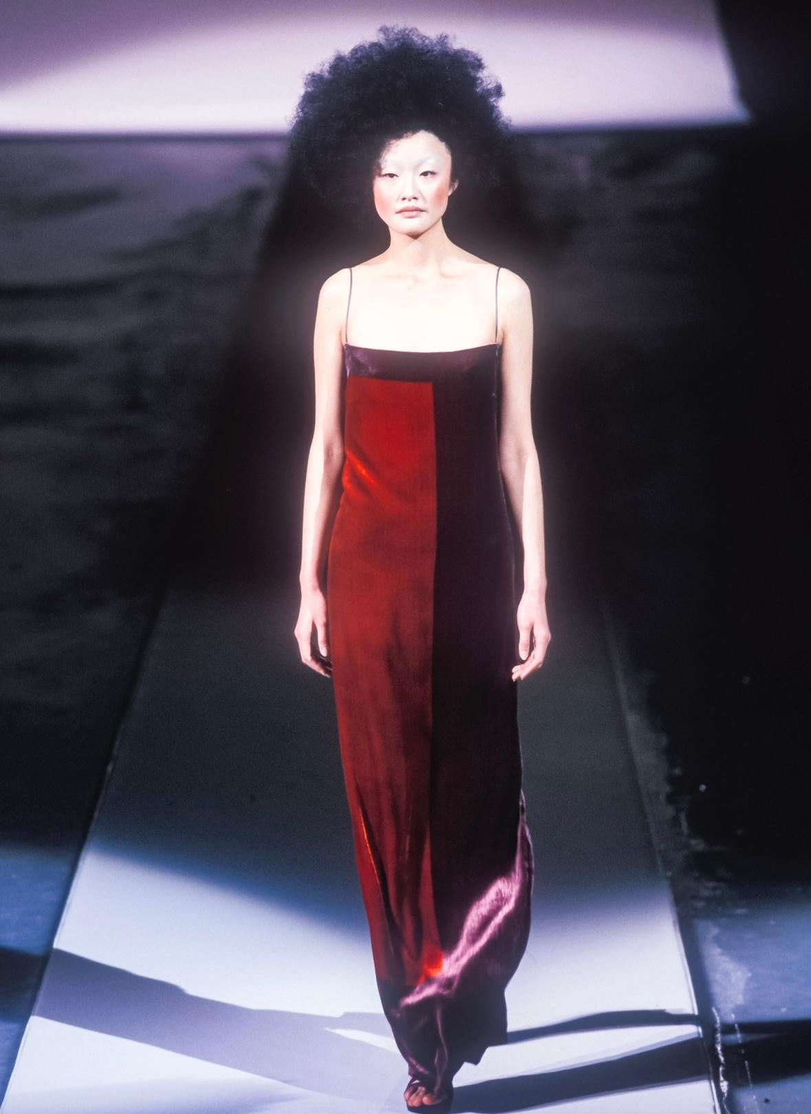 Presenting a stunning red abstract slip gown by Guy LaRoche, designed by Albert Elbaz from the Fall/Winter 1998 collection. A velvet variation of this gown made its debut on the season's runway. Entirely crafted of soft silk, this dress features an