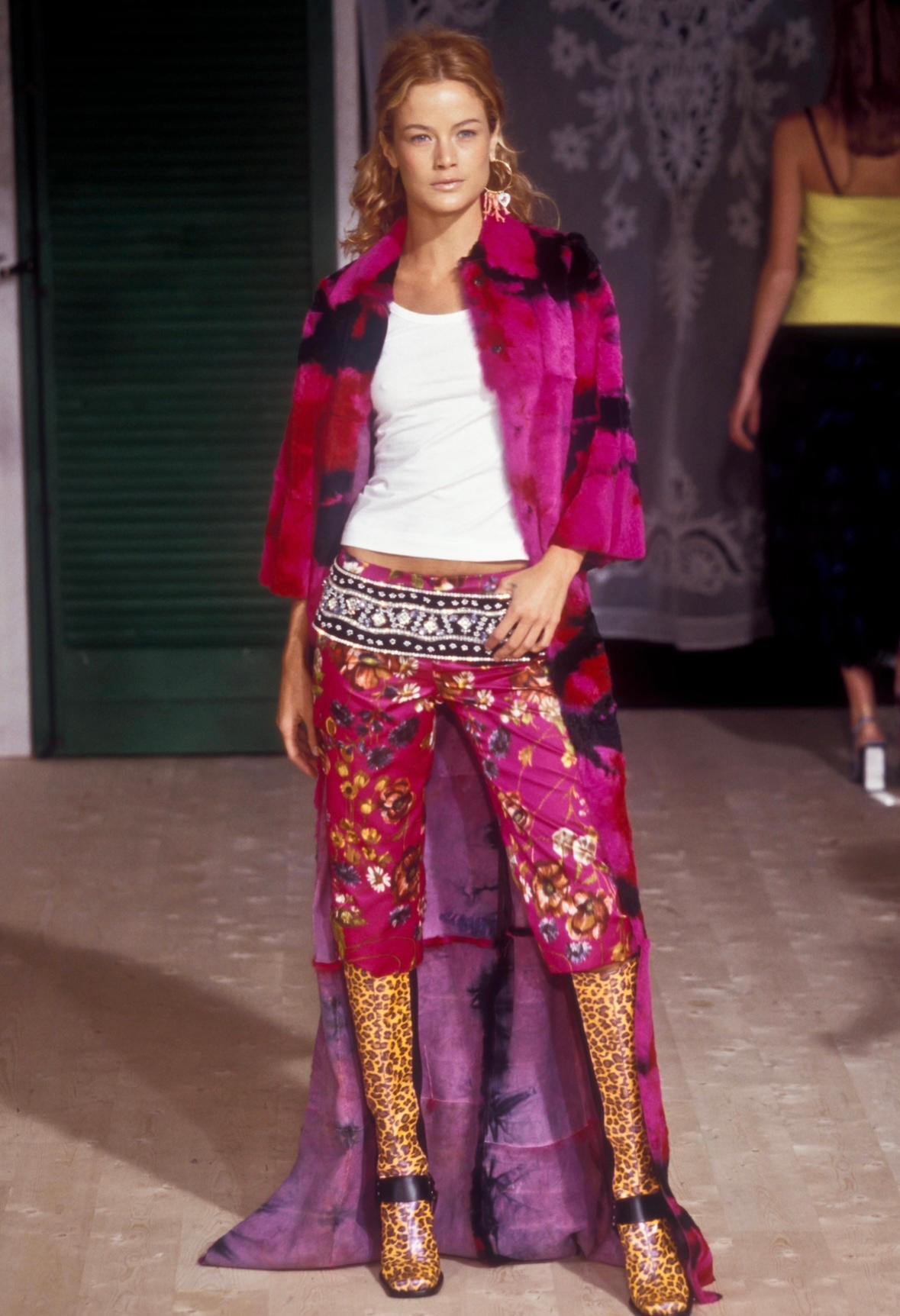 This bright pink tie-dyed coat debuted on the Fall/Winter 1999 Dolce & Gabbana runway, modeled by Carolyn Murphy. Also worn by Maggie Rizer in the September 1999 issue of Vogue, captured by Steven Meisel. This head-turning coat is constructed