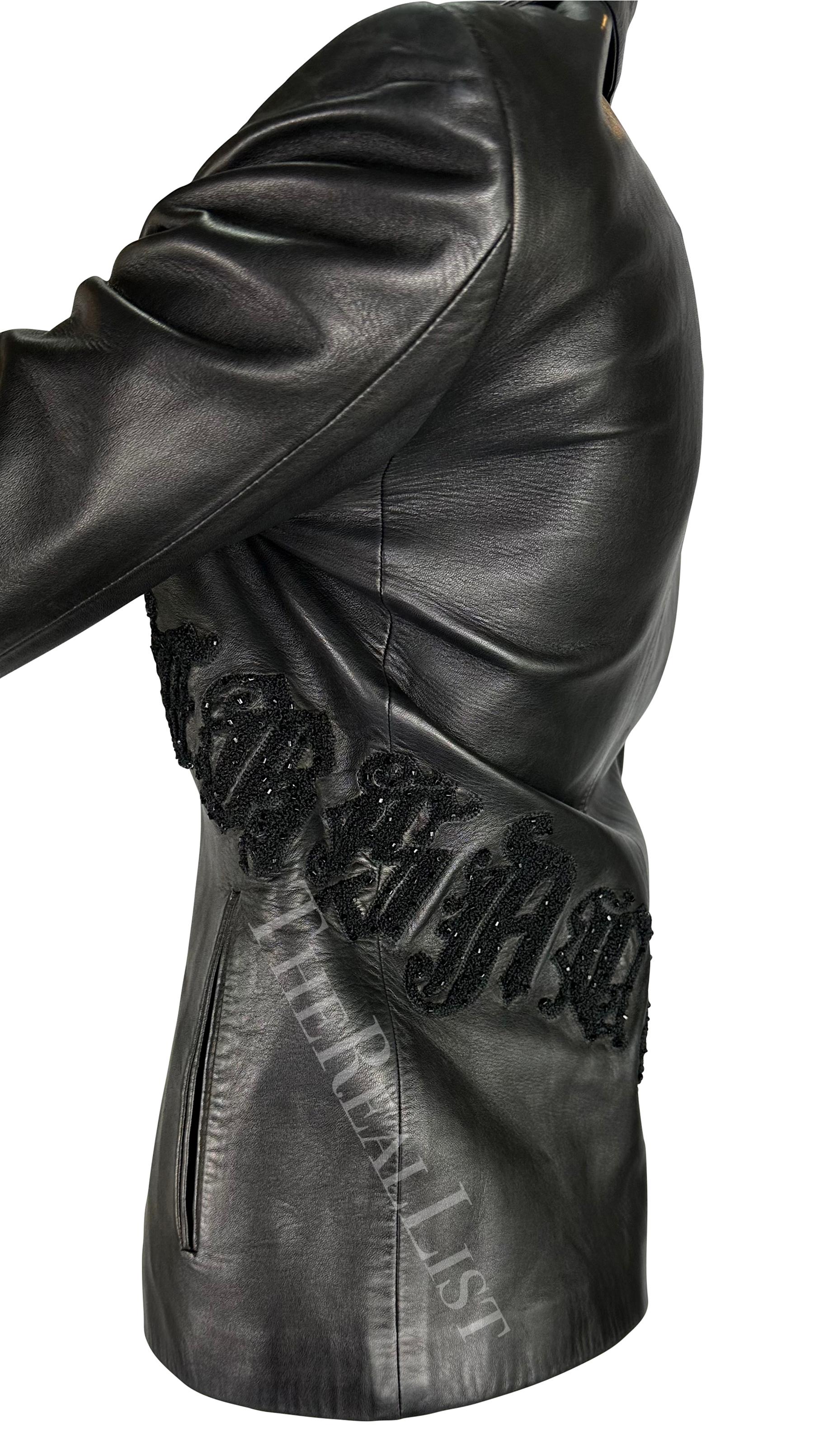 Presenting a black Gianni Versace leather jacket, designed by Donatella Versace. From the Fall/Winter 1999 collection, this jacket is constructed entirely of leather and features a fold-over collar and zip closure. The jacket is amped up with beaded