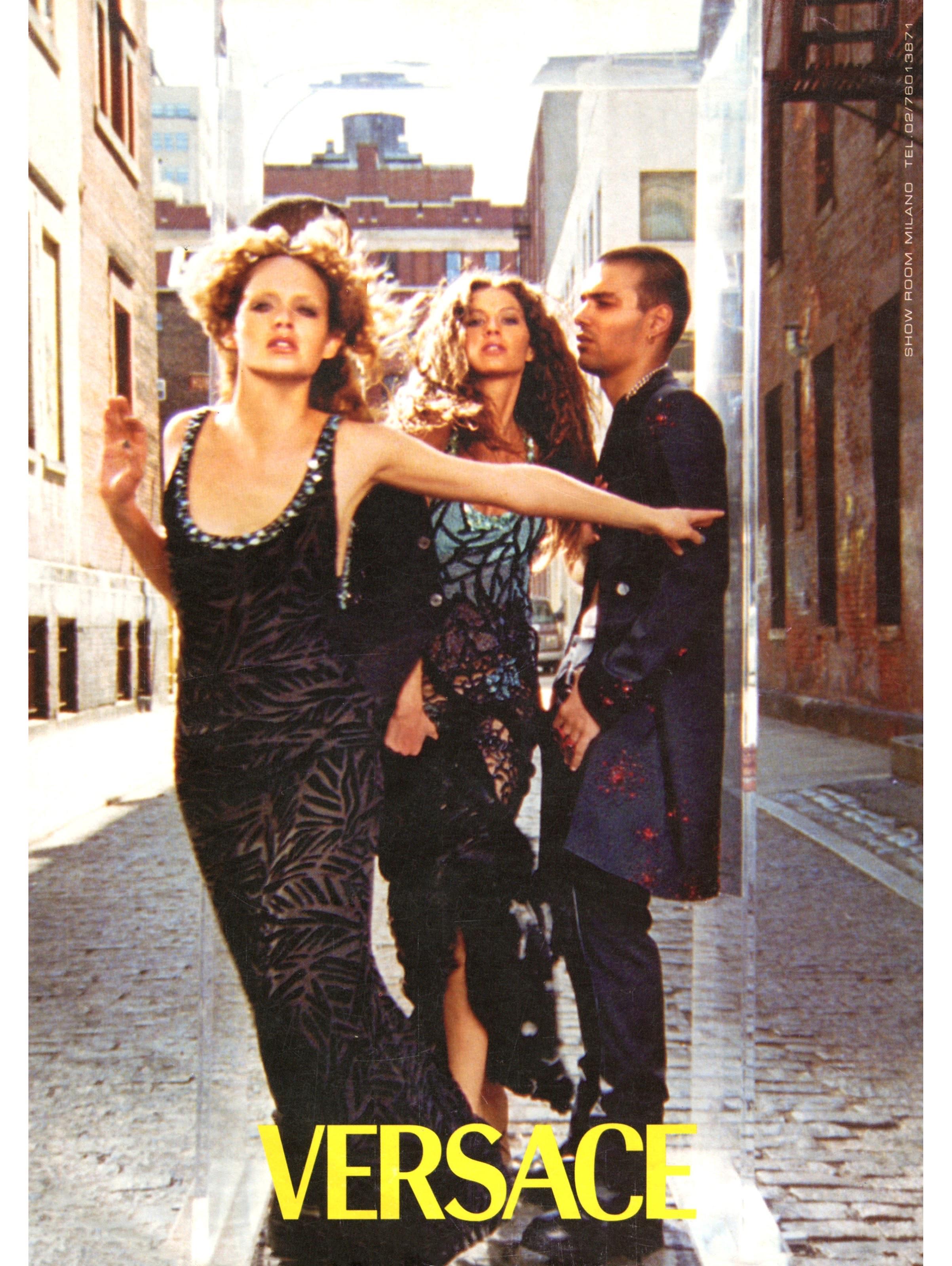 Presenting a beautiful black Gianni Versace strapless dress, designed by Donatella Versace. From the Fall/Winter 1999 collection, the same rhinestone and beading technique was seen on the F/W 1999 menswear collection and in the ad campaign. This