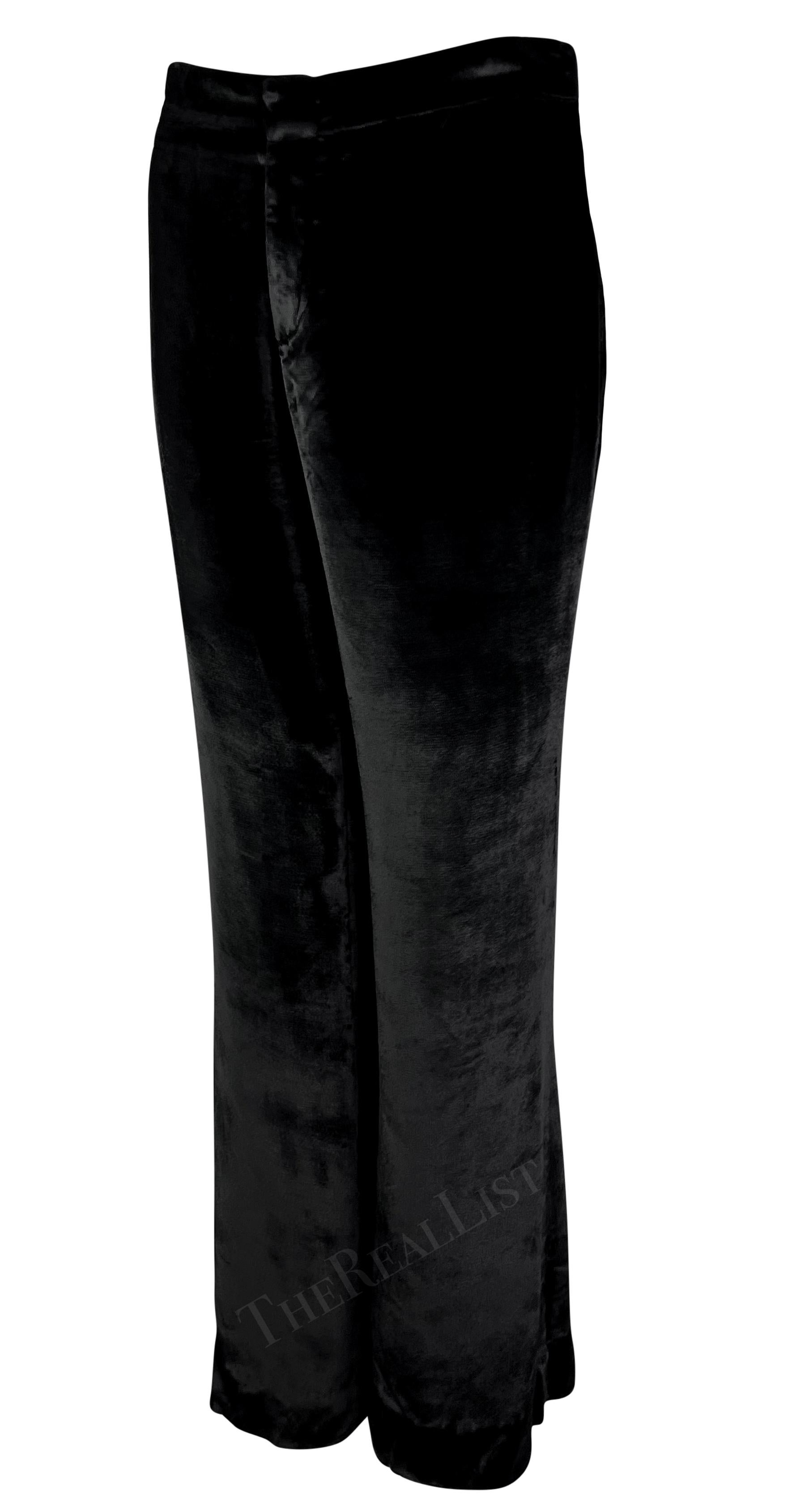 Tom Ford designed this stunning pair of black velvet flared pants for Gucci’s Fall/Winter 1999 collection. Made from soft velvet fabric, these pants feature a flattering flare cut and can be easily dressed up or down for any occasion.

Approximate