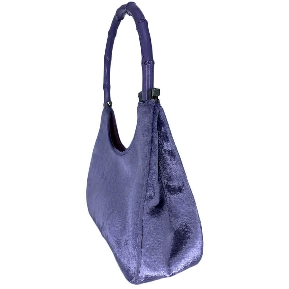 TheRealList presents: a gorgeous silk-lined monochromatic lavender velvet bamboo top handle mini bag. Tom Ford designed this bag for Gucci's F/W 1999 collection. The same shade of velvet was heavily featured in the ad campaign shot by Mario Testino