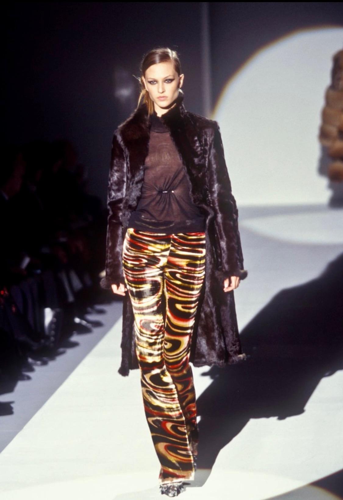 Presenting a double-sided Persian lamb and rabbit fur full-length coat. This iconic Tom Ford design was featured on the F/W 1999 runway presentation twice: on look 19 and look 24. According to Ford, this collection was meant to be cleaner than the