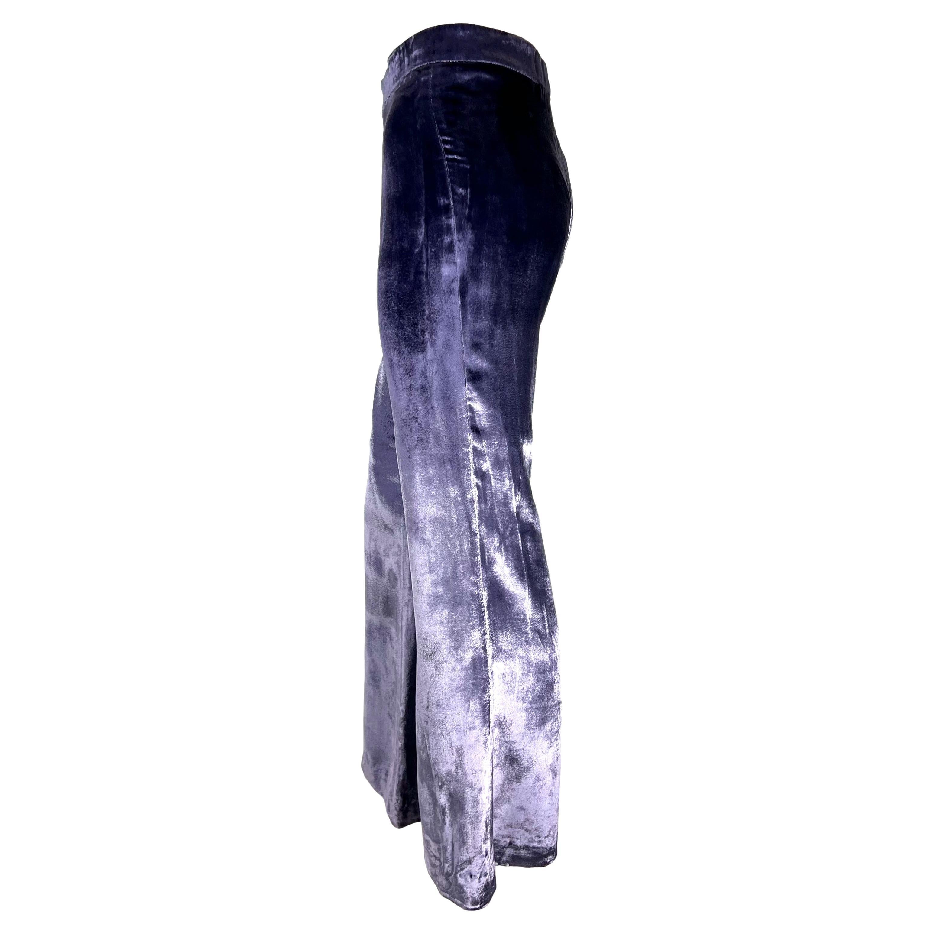 Presenting a gorgeous pair of lavender velvet flared pants designed by Tom Ford for Gucci's Fall/Winter 1999 collection. This shimming velvet debuted on the runway on similar flare pants and accessories. Check out our storefront for these pants in