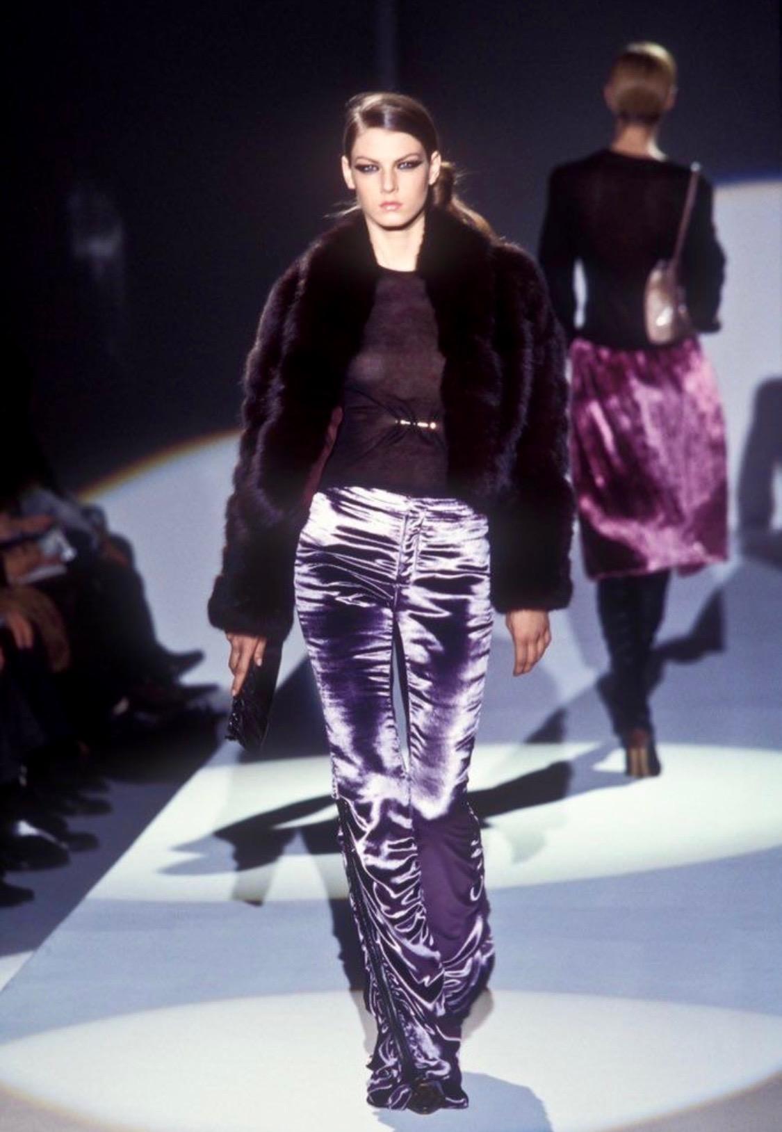 Presenting a pair of fabulous ruched purple velvet pants designed by Tom Ford for Gucci's Fall/Winter 1999 collection. Debuting on the season's runway in lavender and black, these shimmering pants feature leather strips on the sides of each calf to