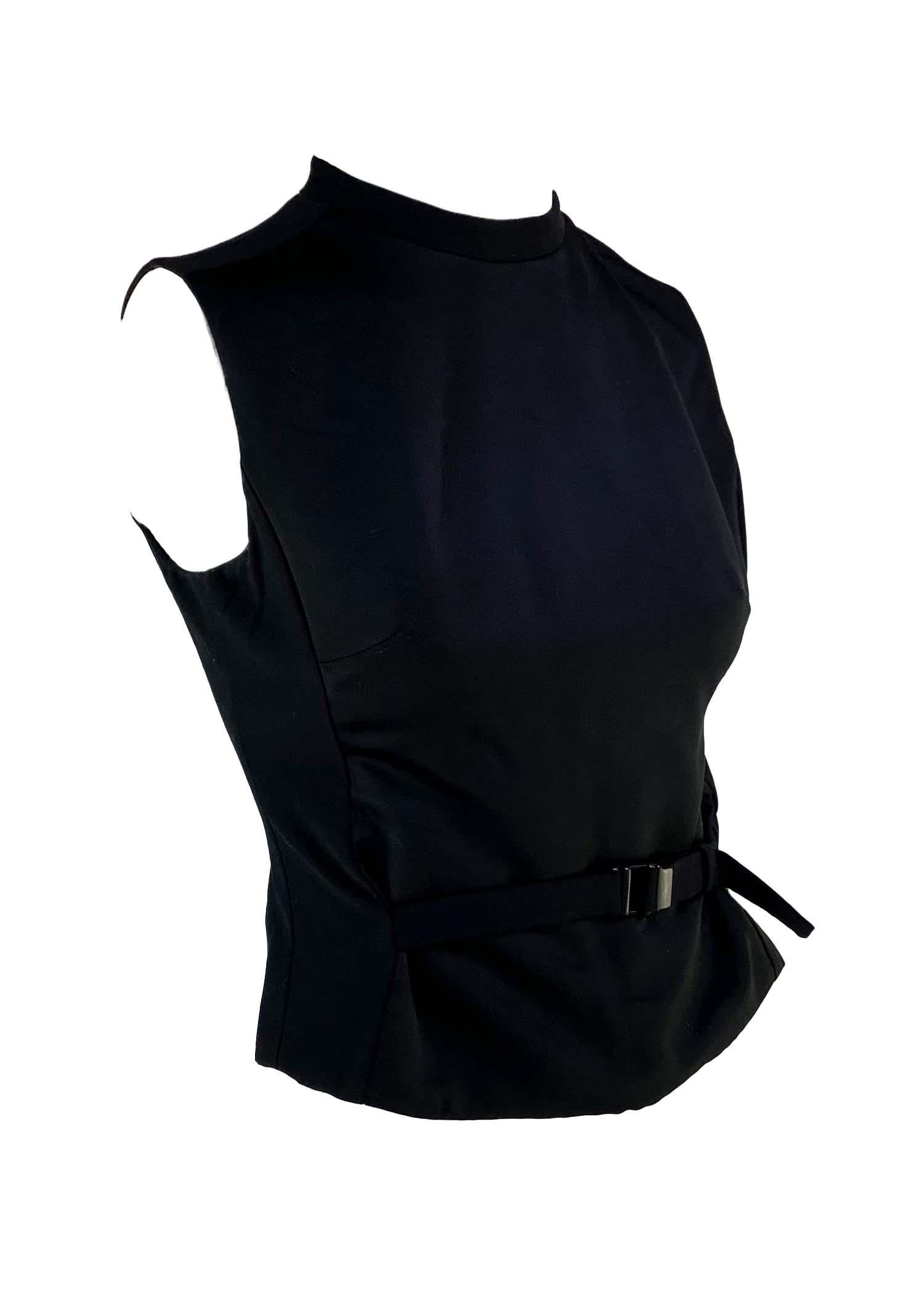 TheRealList presents: a sleek Tom Ford designed take on a Gucci sweater vest. The vest features a satin panel front with a buckle to help create a cinched waist and a zippered back. This top was created by Tom Ford for the Fall/Winter 1999