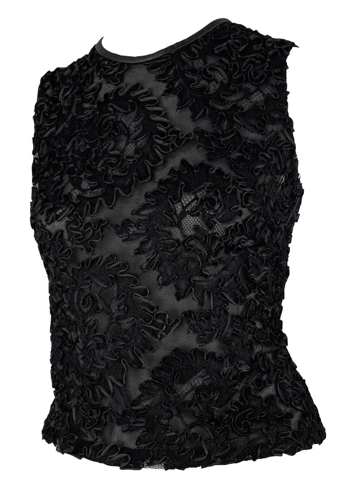 From Gucci’s Fall/Winter 1999 collection under Tom Ford, this sleeveless top features a sheer black mesh base intricately embroidered with swirling floral ribbon appliqués. The high-contrast texture is further highlighted by tonal leather piping at