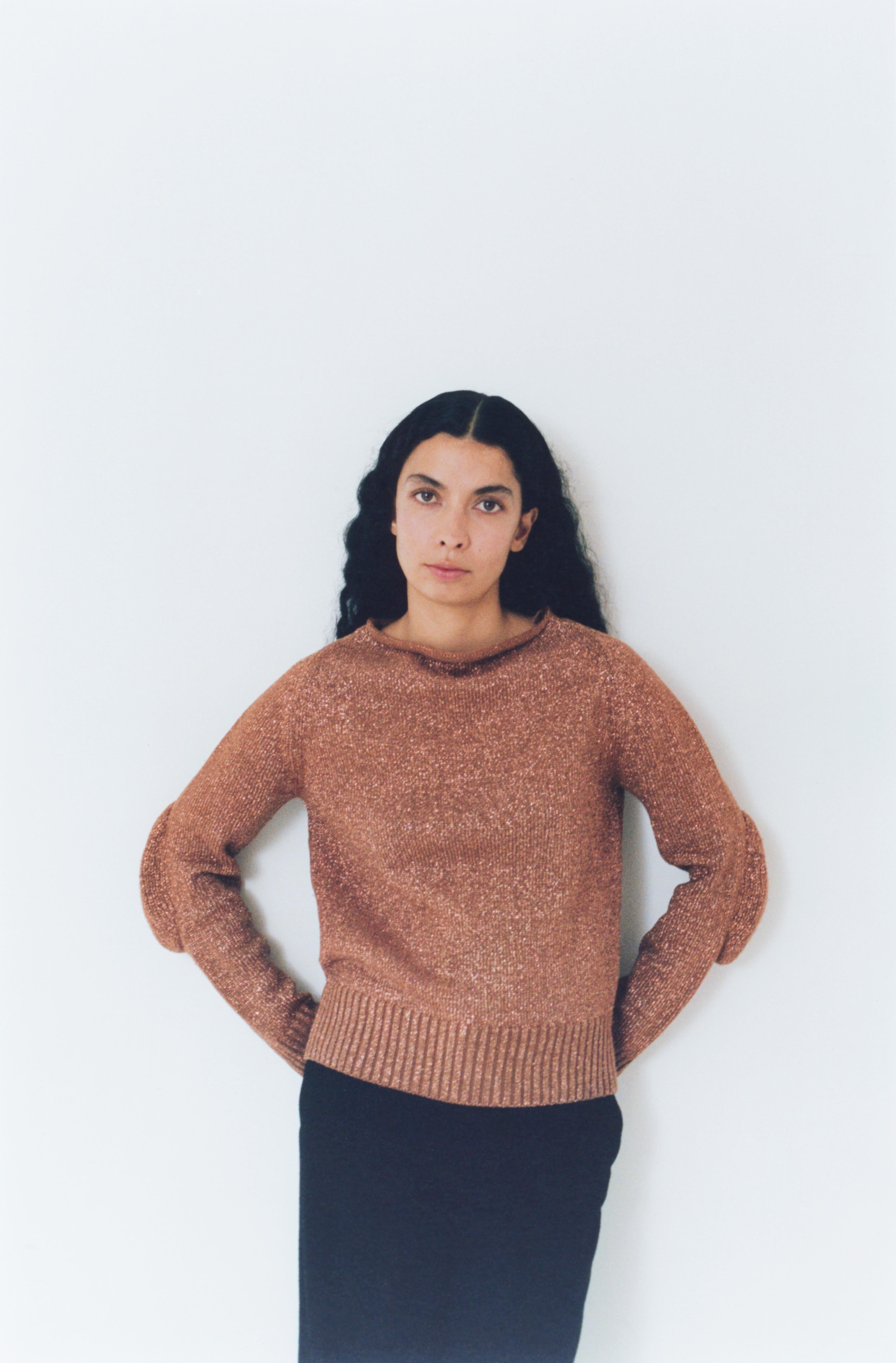 F/W 1999 Maison Martin Margiela boxy fit knit. Wide boat neck with exaggerated 'stretched' elbows. Brown with metallic copper. White label. As seen on runway and Margiela promotional ephemera. Collector's piece.  

“[Margiela] asked Ms. Ferretti to