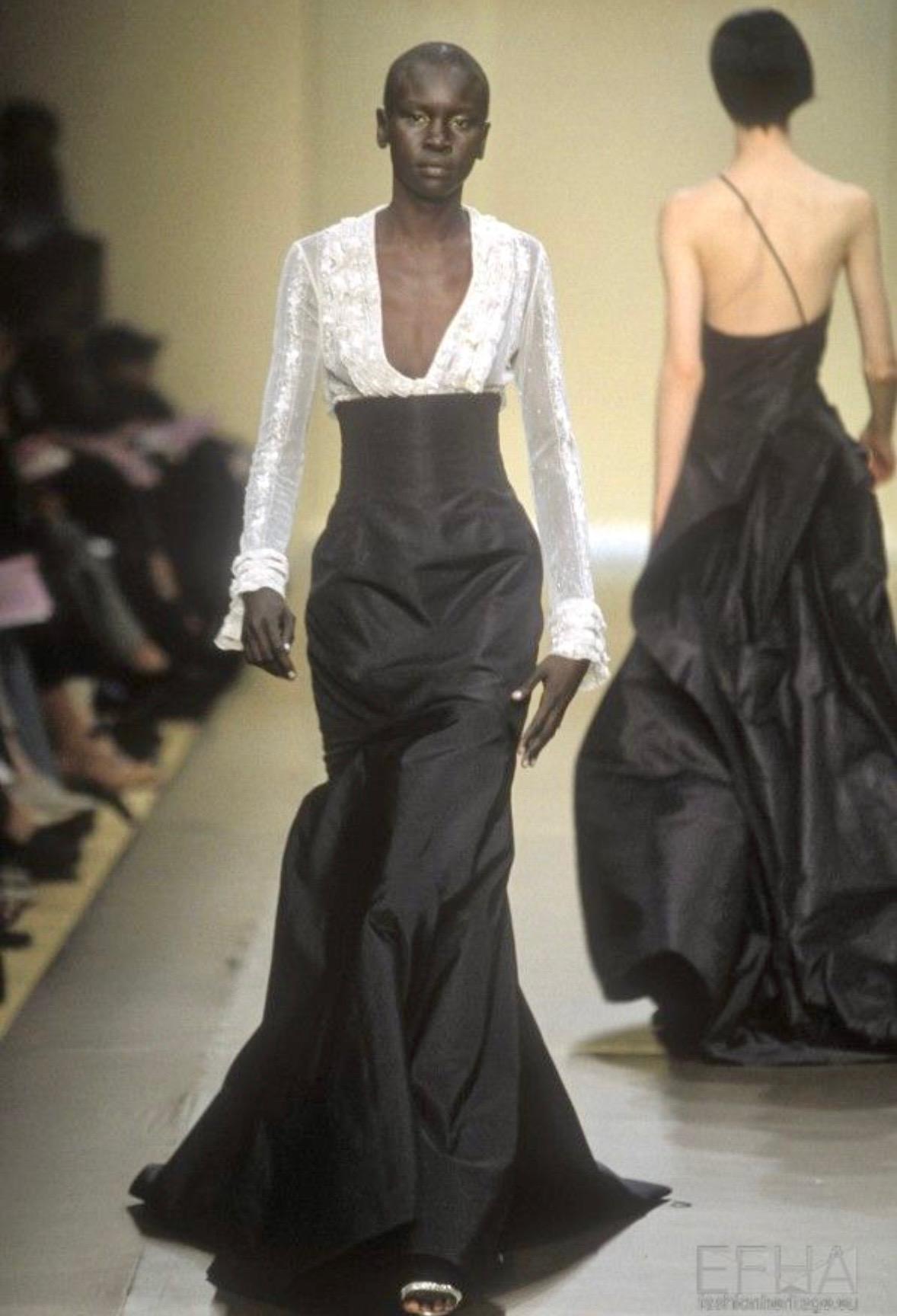 TheRealList presents: an incredible black high-waisted Pierre Balmain Haute Couture full-length skirt, designed by Oscar de la Renta. From the Fall/Winter 2000 collection, this truly fabulous skirt debuted on the season’s runway modeled by Alek Wek.