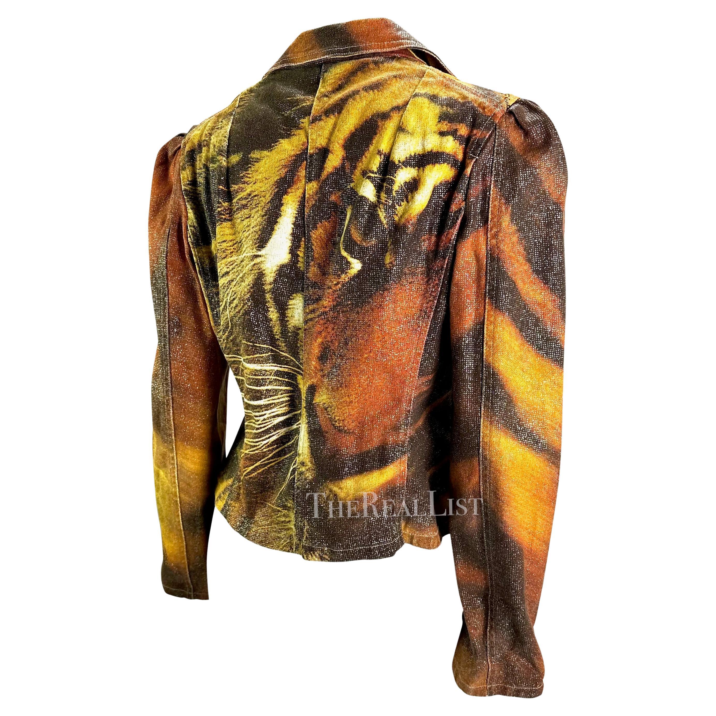 Presenting a Roberto Cavalli tiger blazer. From the Fall/Winter 2000 collection, this jacket boldly features Cavalli’s iconic tiger pattern. Featuring a cropped body, button closure, and slightly puffy shoulders this jacket is a Y2K dream. Check out