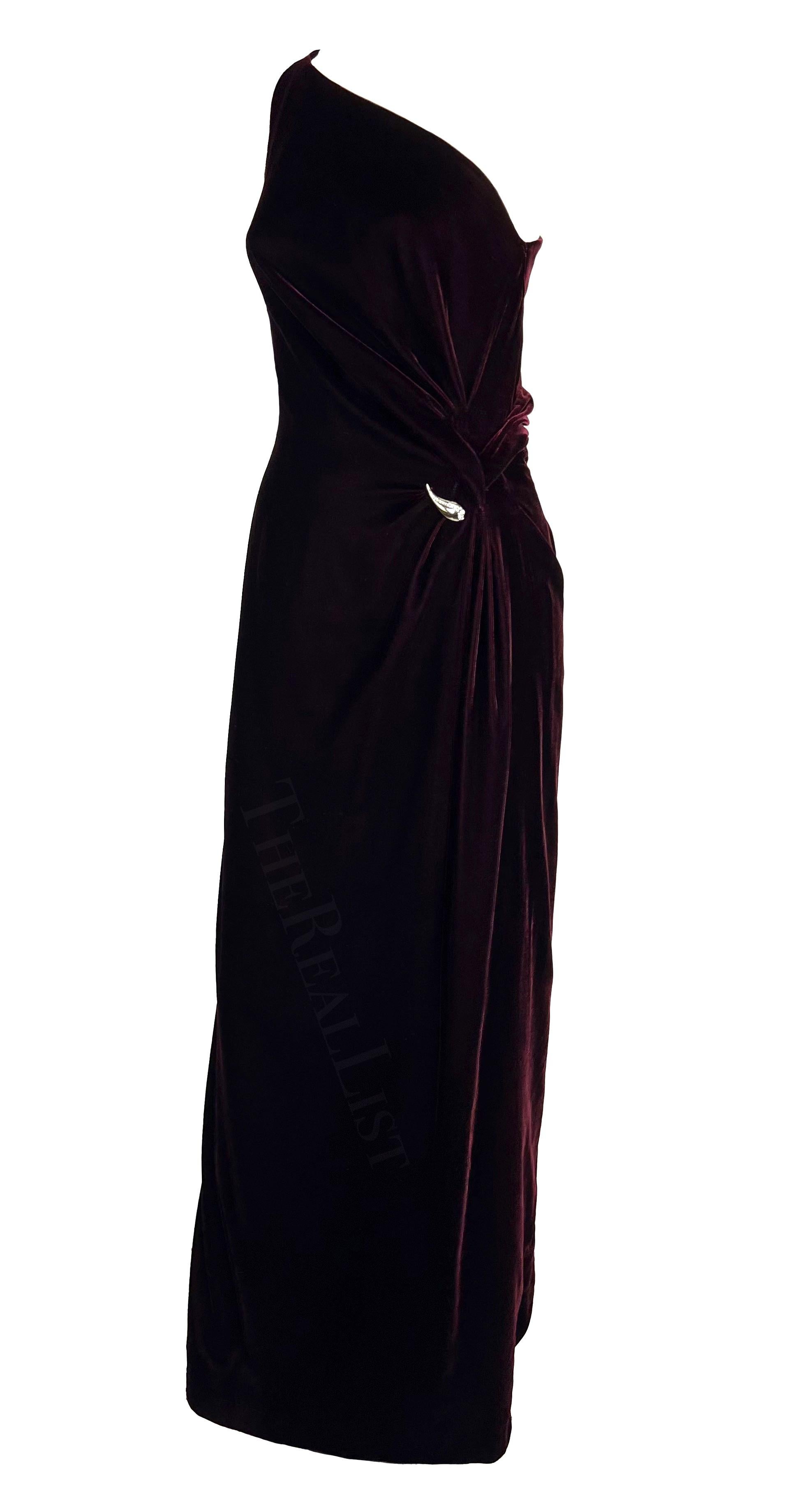 Presenting an incredible deep burgundy Thierry Mugler velvet gown, designed by Manfred Mugler. From the Fall/Winter 2000 collection, this dress debuted on the season's runway in dark green. Constructed entirely of luxurious velvet, this floor-length