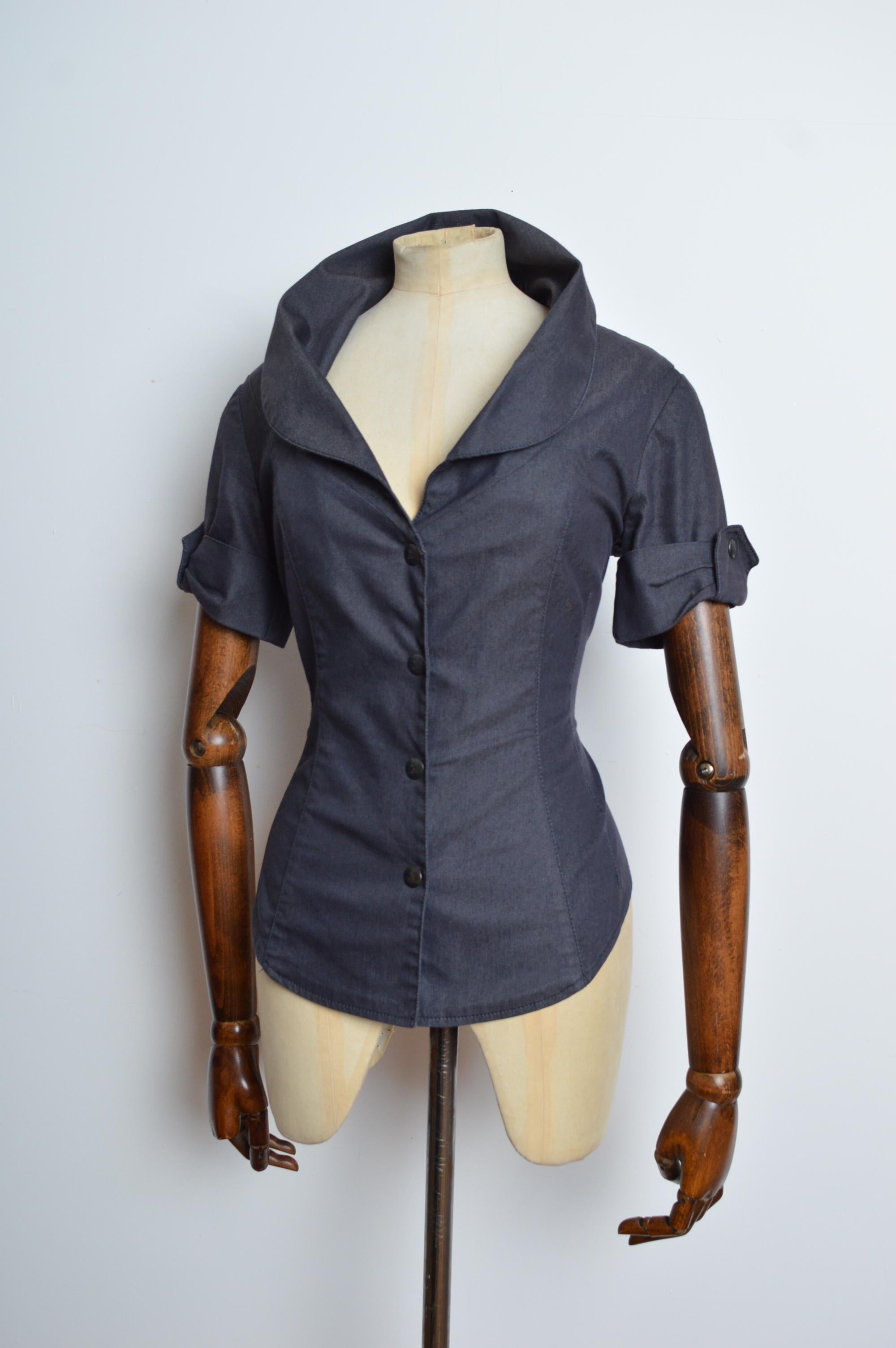 F/W 2000 Vivienne Westwood Red Label Corset Shirt & Grey Pencil Skirt Set
MADE IN ITALY
Features; Orb press stud closure buttons, typical Westwood fitted silhouette and stretchy material. 
Colour; Charcoal Grey
Size; Recommended UK 10 to