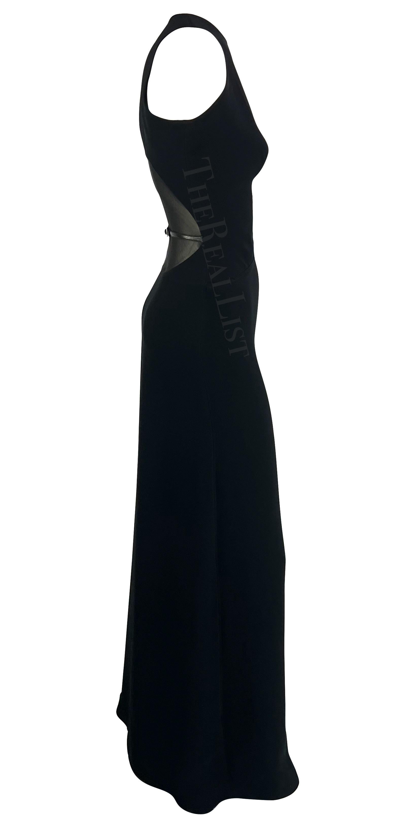 Presenting a fabulous black sleeveless gown designed for Paco Rabanne’s Fall/Winter 2001 runway collection. This elegant form-fitting dress features a high neckline and a sheer mesh-covered cutout at the back accented with a small adjustable leather