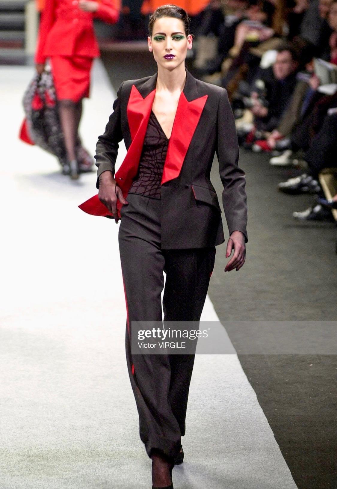 TheRealList presents: a Thierry Mugler pantsuit with red silk satin details, from Manfried Thierry Mugler's final collection before his retirement, the Fall/Winter 2001 