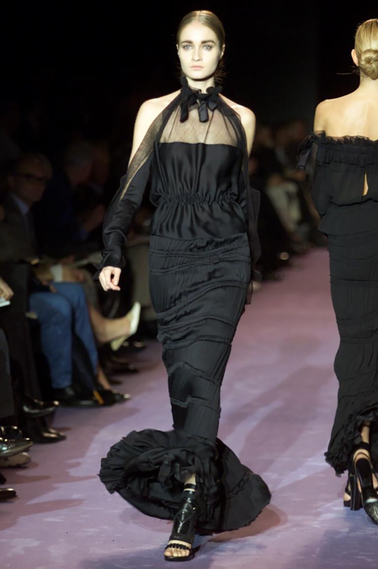 Yves Saint Laurent black maxi skirt from the Fall/Winter 2001 Mexican collection by Tom Ford. Many layers of black silk chiffon with gathering and asymmetrical seams create a luxurious bohemian style that drapes and moves beautifully. Sits at the