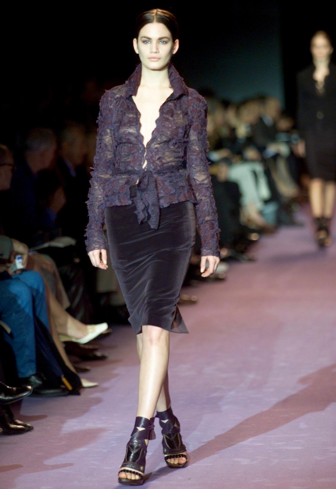 Presenting a sheer embroidered floral lace blouse designed by Tom Ford for Yves Saint Laurent Rive Gauche's Fall/Winter 2001 collection. Debuting on look 7 on Vicky Andrén in the season's runway presentation, this piece features hook and eye