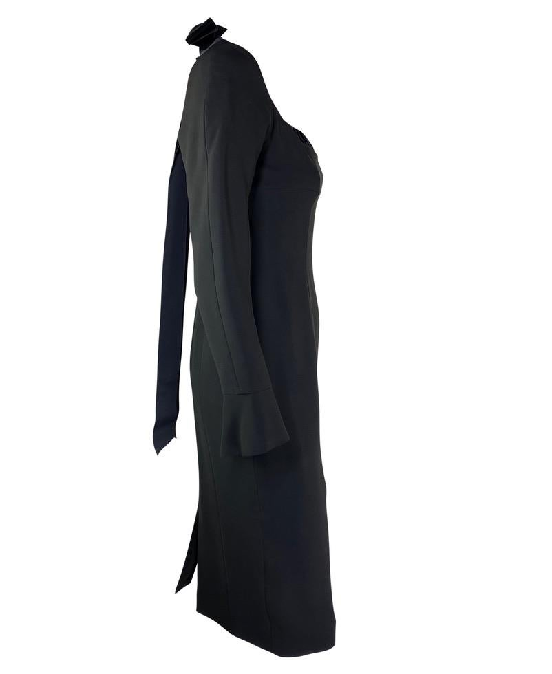 Presenting a timeless Yves Saint Laurent Rive Gauche little black dress, designed by Tom Ford. From the Fall/Winter 2001 collection, this stunning midi dress in black features a fitted body with an open neckline. The sleeves are tailored with a