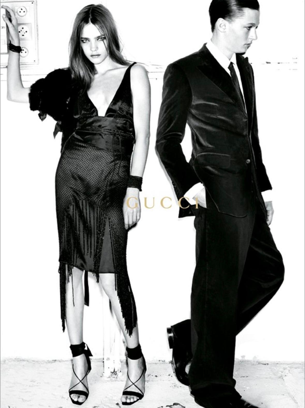 From Tom Ford's Fall/Winter 2002 gothic 1920s-1930s inspired collection for Gucci, the mid-length version of this fabulous black silk gown debuted on the season's runway as look 31, modeled by Carmen Kass. The mid-length version was further