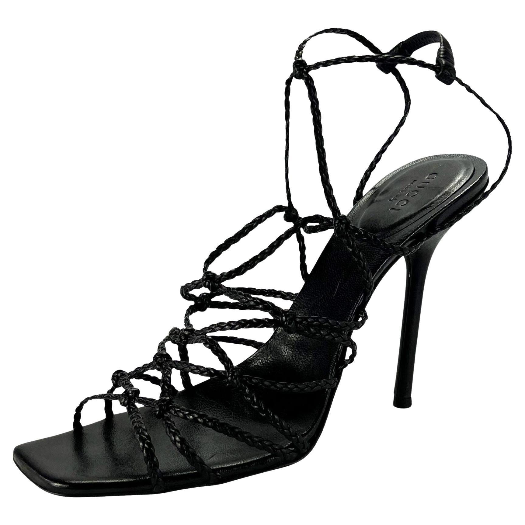 Presenting a pair of black leather braided Gucci strap heels, designed by Tom Ford. From 2002, these gorgeous heels feature a square toe and have interwoven braided leather wrapping the foot from the toe to the ankle. These Y2K pumps are