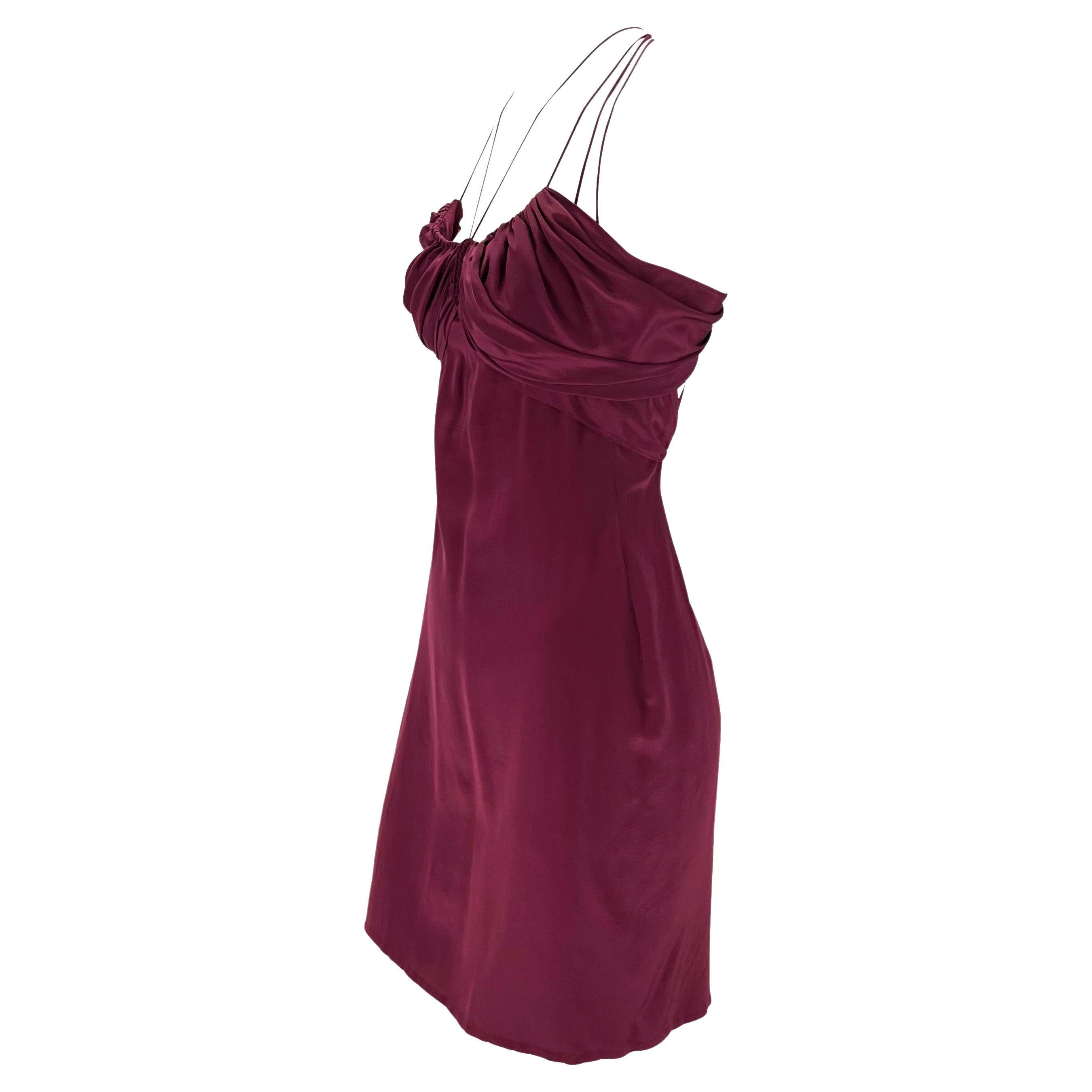 Presenting a beautiful plum Gucci mini dress, designed by Tom Ford. From Fall/Winter 2002, this stunning dress features ruched fabric at the bust with several thin straps which meet at the neck and are braided at the back. The dress features a