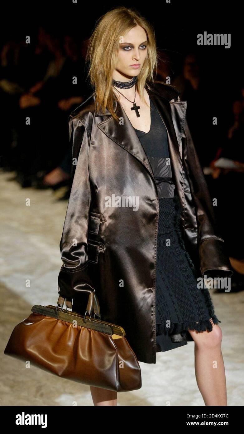 Presenting a wood frame ostrich bag by Tom Ford for Gucci. This piece was designed for the F/W 2002 collection and features the same braided leather and distressed wood accents that were prominently featured on the runway. The magnetic kiss-lock