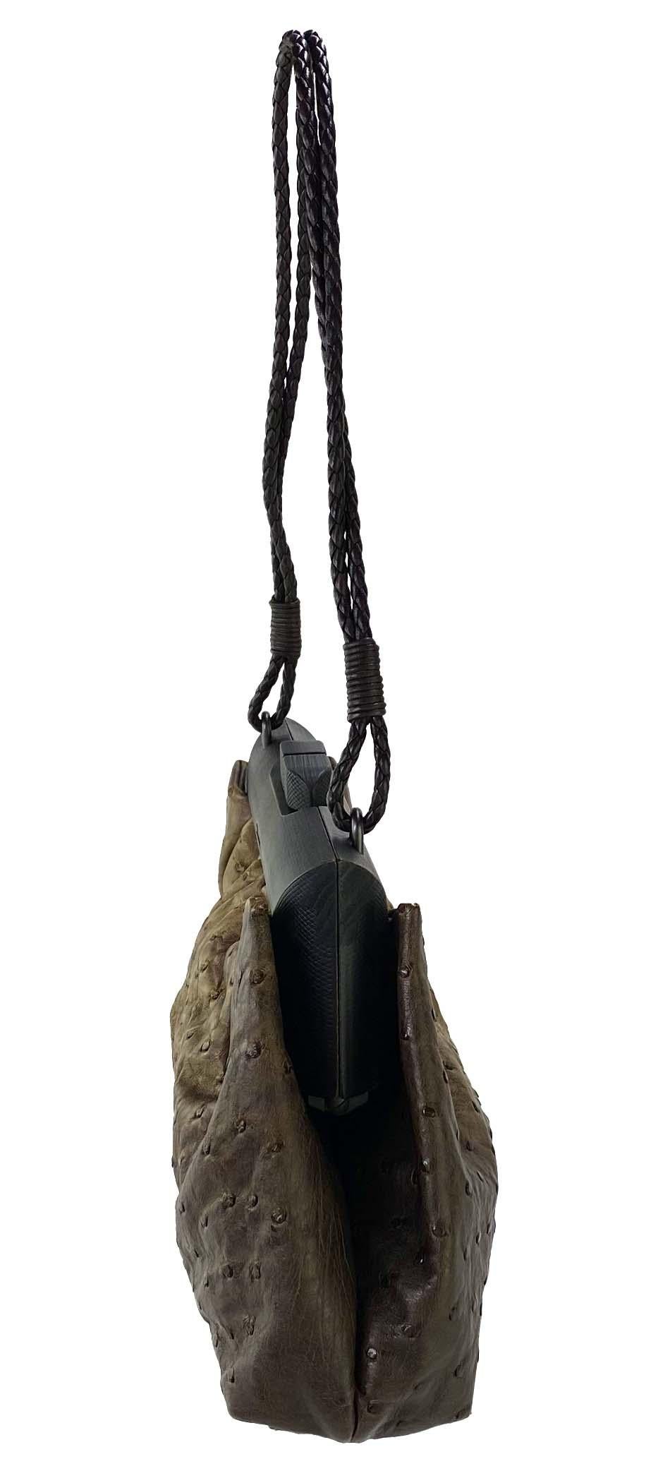 Presenting a wood frame genuine ostrich leather bag by Tom Ford for Gucci. This piece was designed for the Fall/Winter 2002 collection and features the same braided leather and distressed wood accents that were prominently featured on the runway.