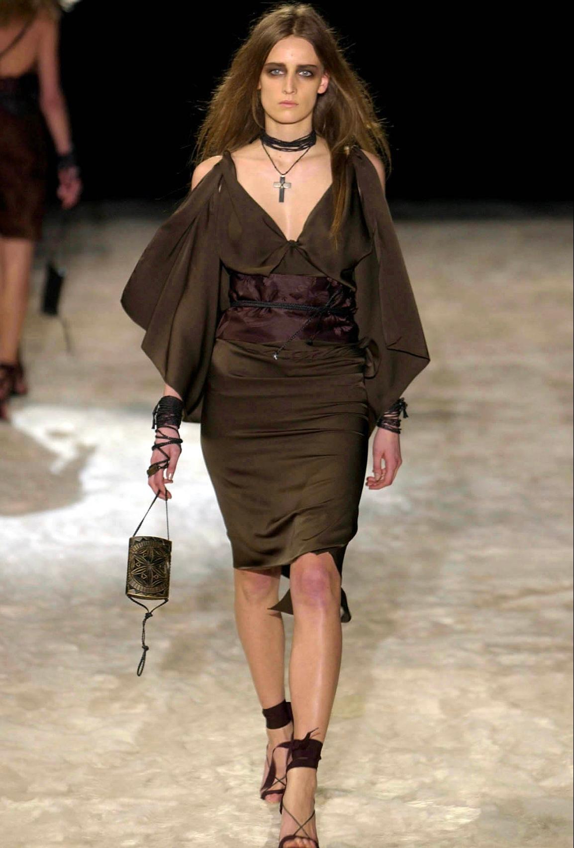 Presenting an incredible brown carved wood Gucci bag, designed by Tom Ford. From the Fall/Winter 2002 collection, this gothic and punk-rock-inspired bag debuted on the season's runway as part of look 29, modeled by Anne Catherine Lacroix. This