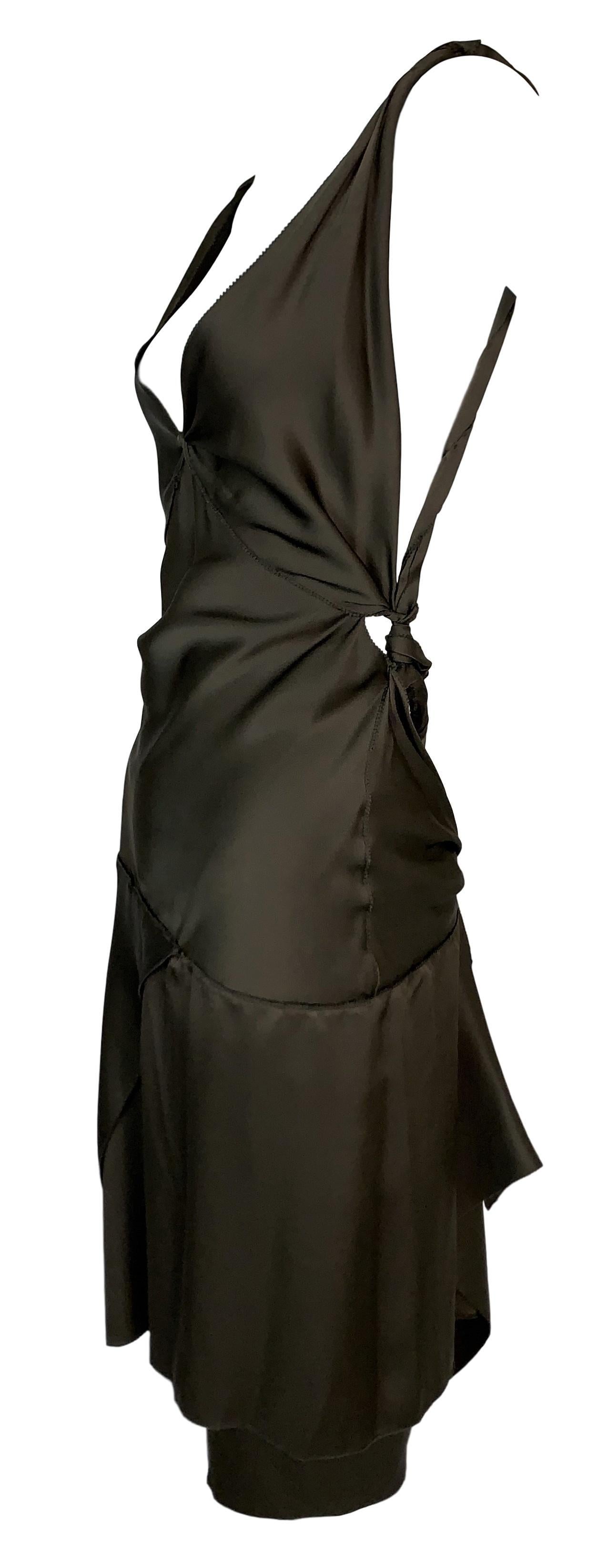 DESIGNER: F/W 2002 Gucci by Tom Ford Runway- its an olive green/brown color

Please contact for more information and/or photos.

CONDITION: Good- minor faint mark inside the dress- see last photo

MATERIAL: tag removed- its silk

COUNTRY MADE: