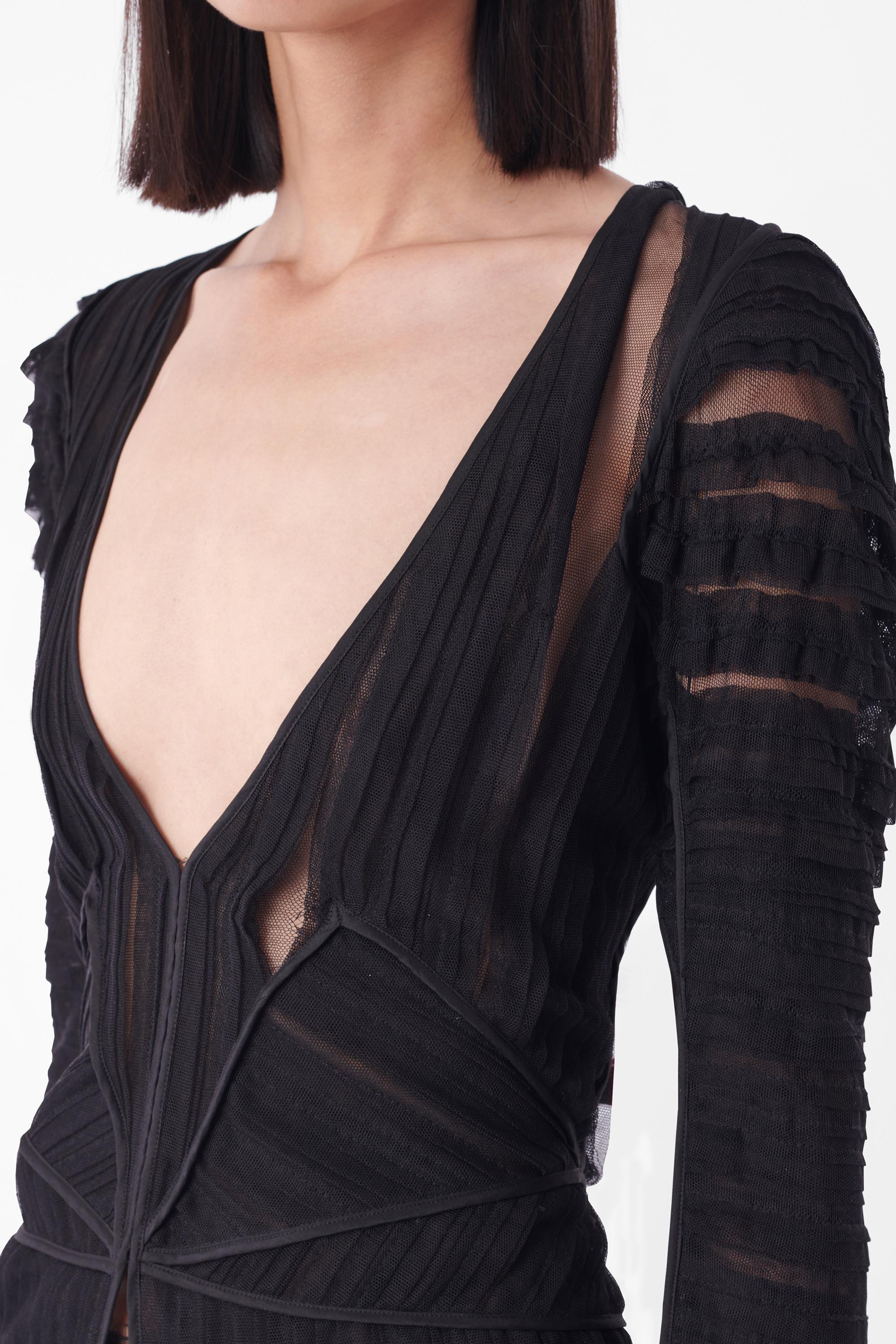 Tom Ford for Yves Saint Laurent Fall Winter 2002 black blouse, runway look 8. Features deep v-front, sheer pleat design allover, split flared cuffs, piped edges with small split centre front and zip back closure. In excellent vintage