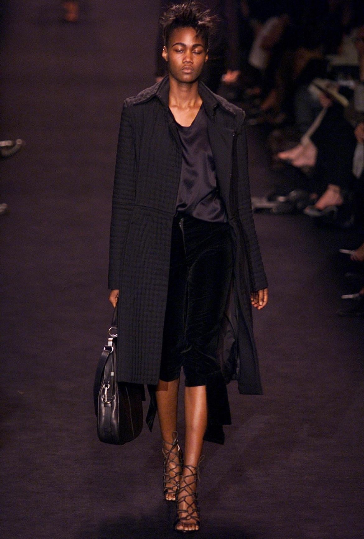 Presenting a deep navy Yves Saint Laurent Rive Gauche velvet skirt, designed by Tom Ford. From the Fall/Winter 2002 collection, this skirt debuted on the season's runway as part of look 17 modeled by Valery Prince and look 24 modeled by Karolina