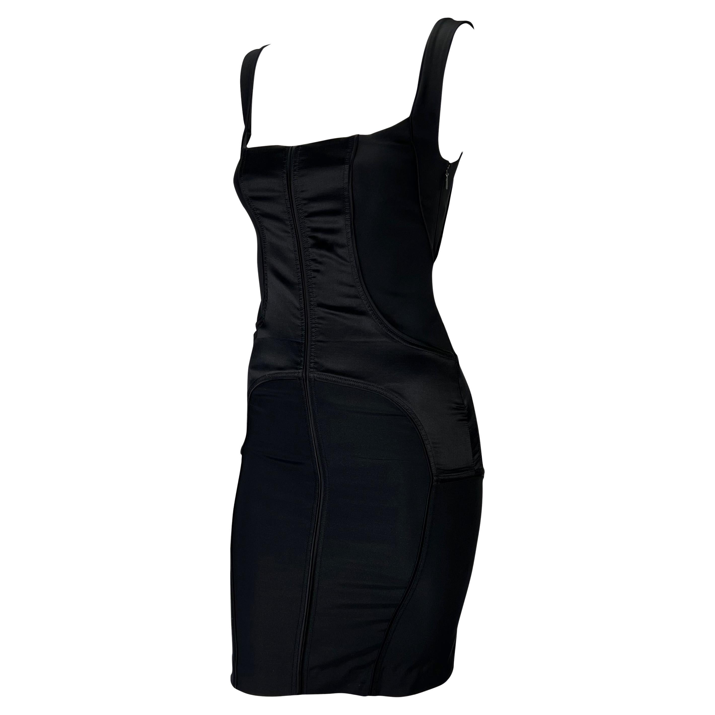 Presenting a stunning silk satin paneled Gucci bodycon dress, designed by Tom Ford. From the Fall/Winter 2003 collection, this dress features a square neckline and small slit in the back. Stretchy and formfitting, this dress clings to the body and
