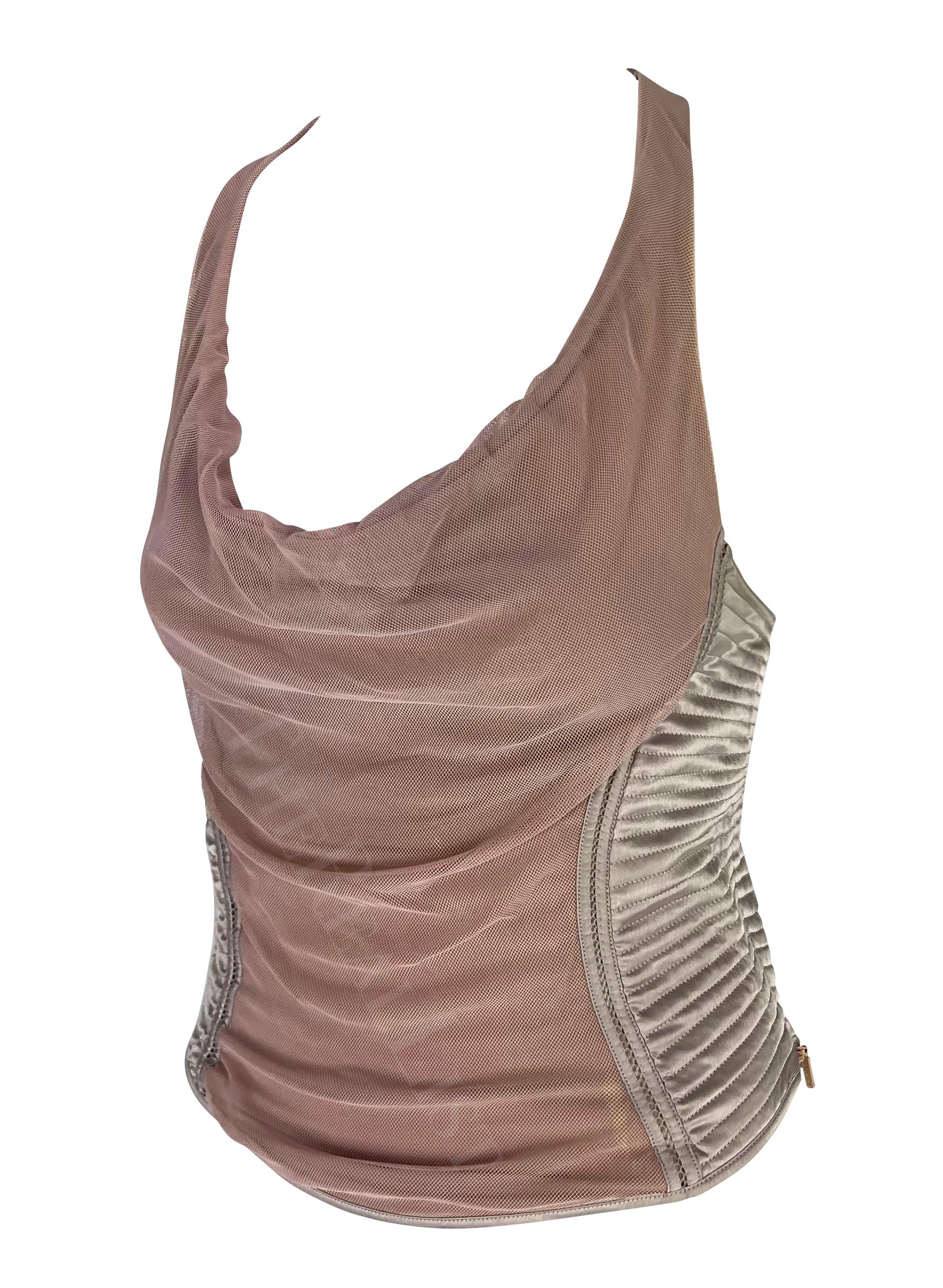 Presenting a blush Gucci racerback tank top, designed by Tom Ford. From the Fall/Winter 2003 collection, this cowl neck sleeveless top features a tulle mesh panel at the front and down the back. The top is made complete with a quilted silvery satin
