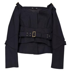 A/I 2003 Gucci by Tom Ford: giacca con cintura e corsetto in passerella