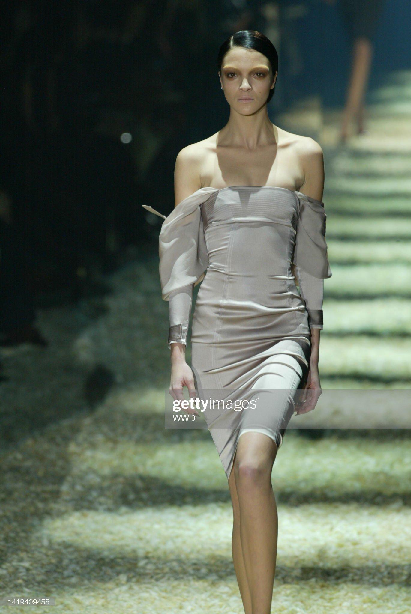 Presenting a chic dusty pink satin Gucci dress, designed by Tom Ford. From the Fall/Winter 2003 collection, this dress debuted on the season's runway as look 28, modeled by Mariacarla Boscono. This fabulous dress features a satin body and sleeves