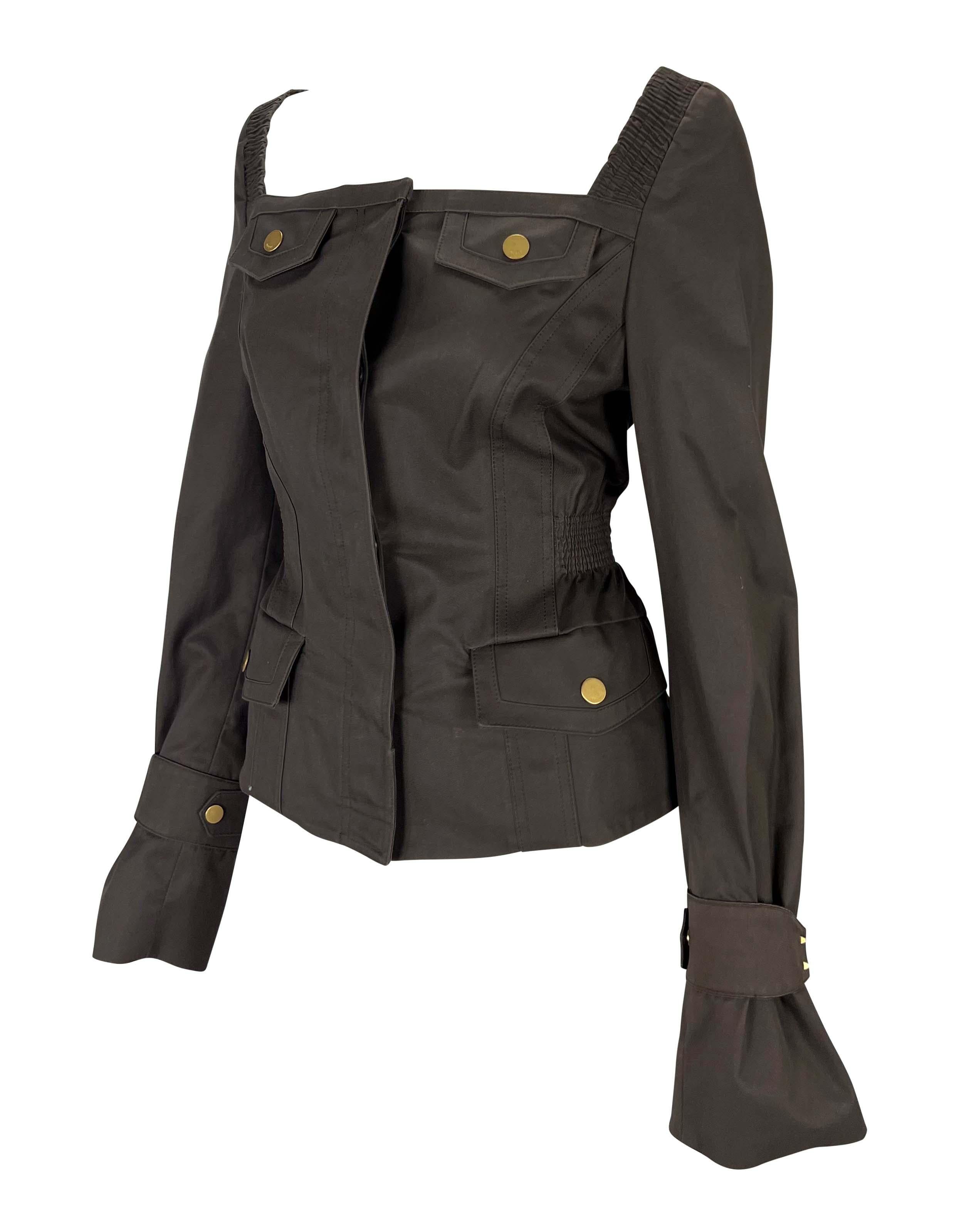 TheRealList presents: a beautiful brown Gucci jacket, designed by Tom Ford. From the Fall/Winter 2003 collection, this cotton jacket features a cut out neckline, bell cuffs, and front pockets at the breasts and hips. This jacket is made complete