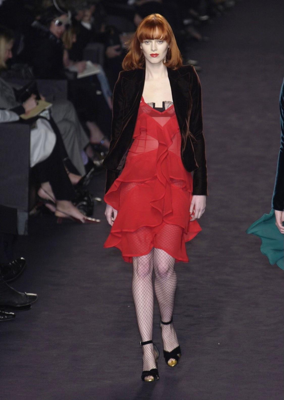 Presenting a bouncy bright red ruffled semi-sheer bodycon skirt designed by Tom Ford for Yves Saint Laurent Rive Gauche's Fall/Winter 2003 collection. The dress version of this skirt debuted on the season's runway as part of look number 2 on Karen